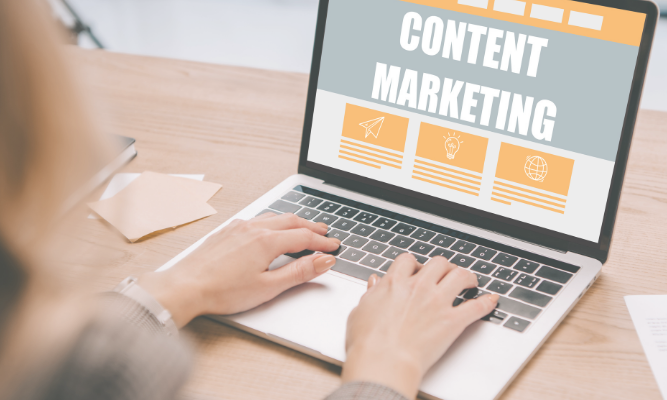Person typing on a laptop displaying a content marketing dashboard, representing a smarter, quality-focused content marketing strategy.