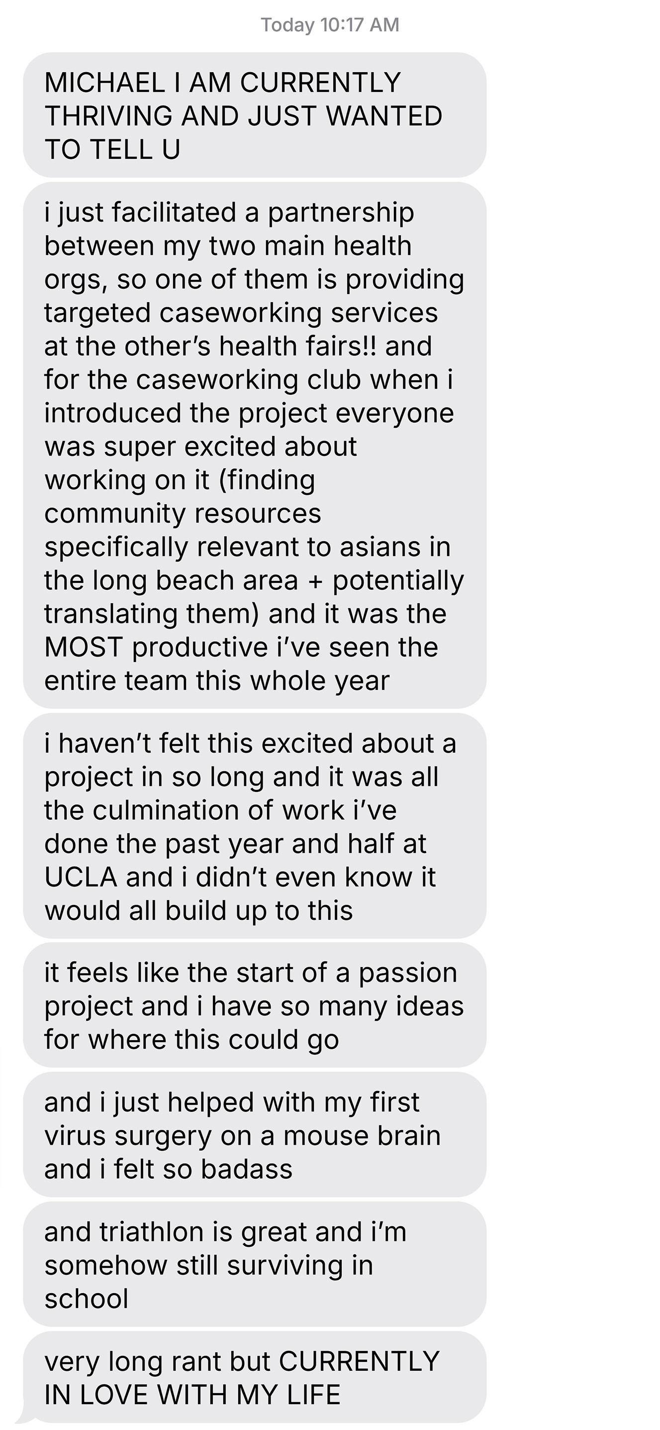 Screenshot of a text message expressing excitement about facilitating a health partnership, productive teamwork at UCLA, involvement in virus surgery on a mouse brain, enjoying triathlon, and overall feeling in love with life.
