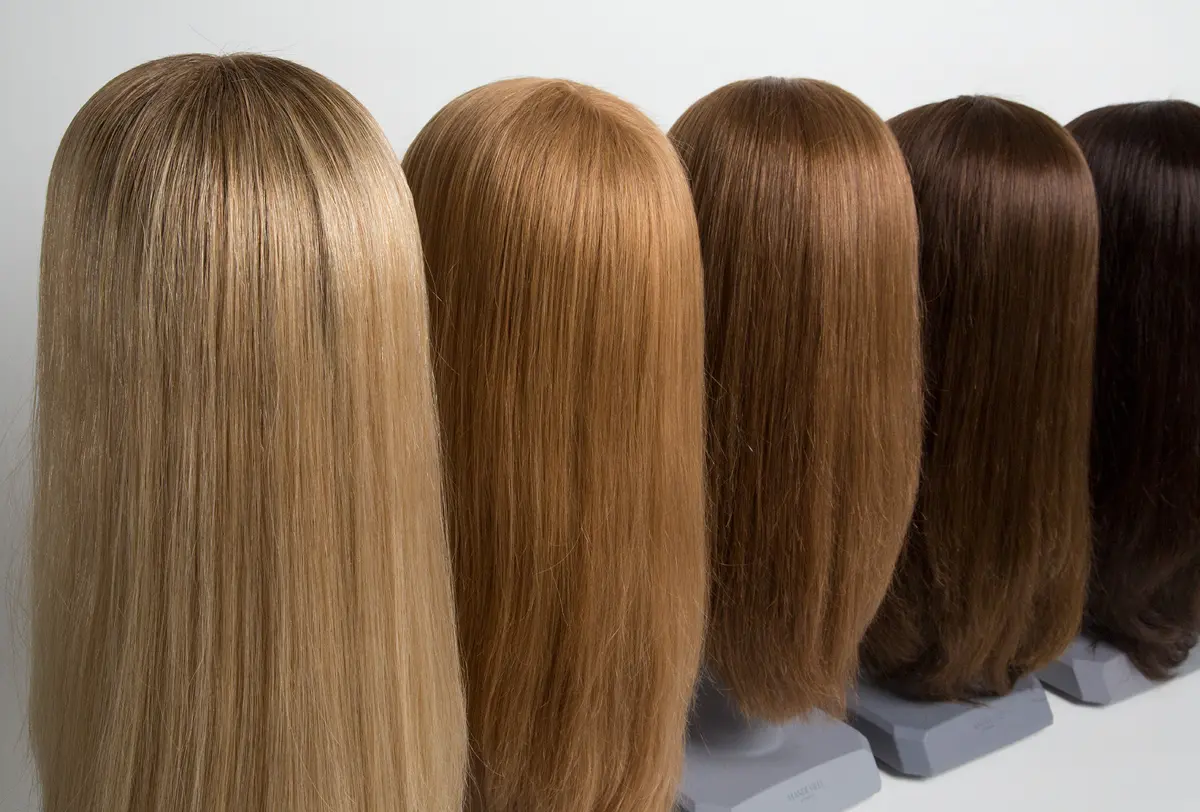 Back view of two men wearing natural-looking wigs for hair loss solutions