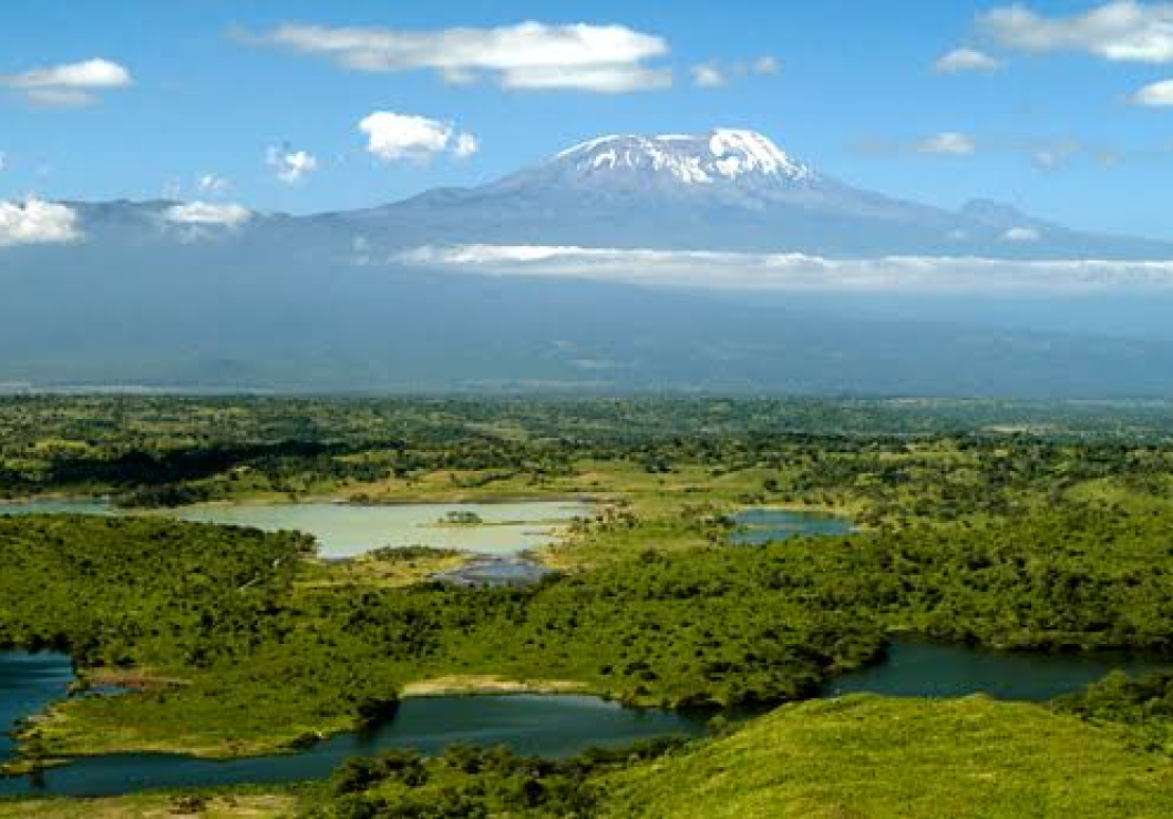 Arusha National Park is nestled at the foothills of Mount Meru, an imposing volcanic peak that stands proudly at over 4,500 meters, and is a treasure trove of biodiversity
