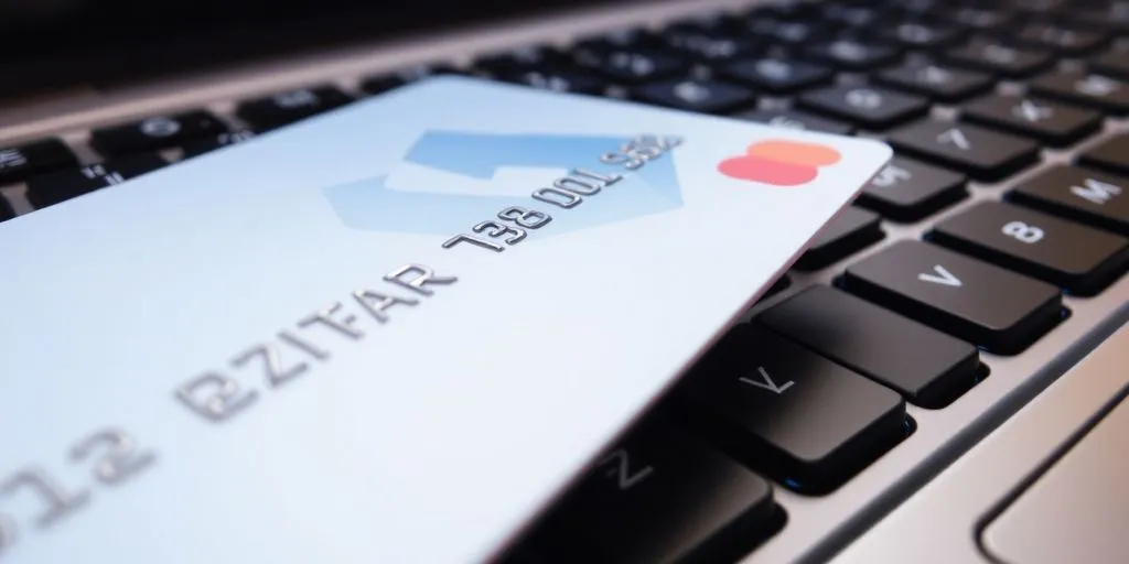 Close-up of a credit card and keyboard.