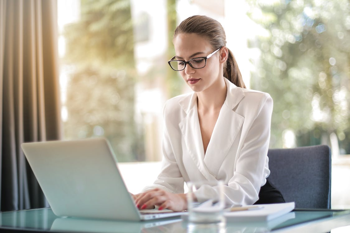 Female entrepreneur working on laptop