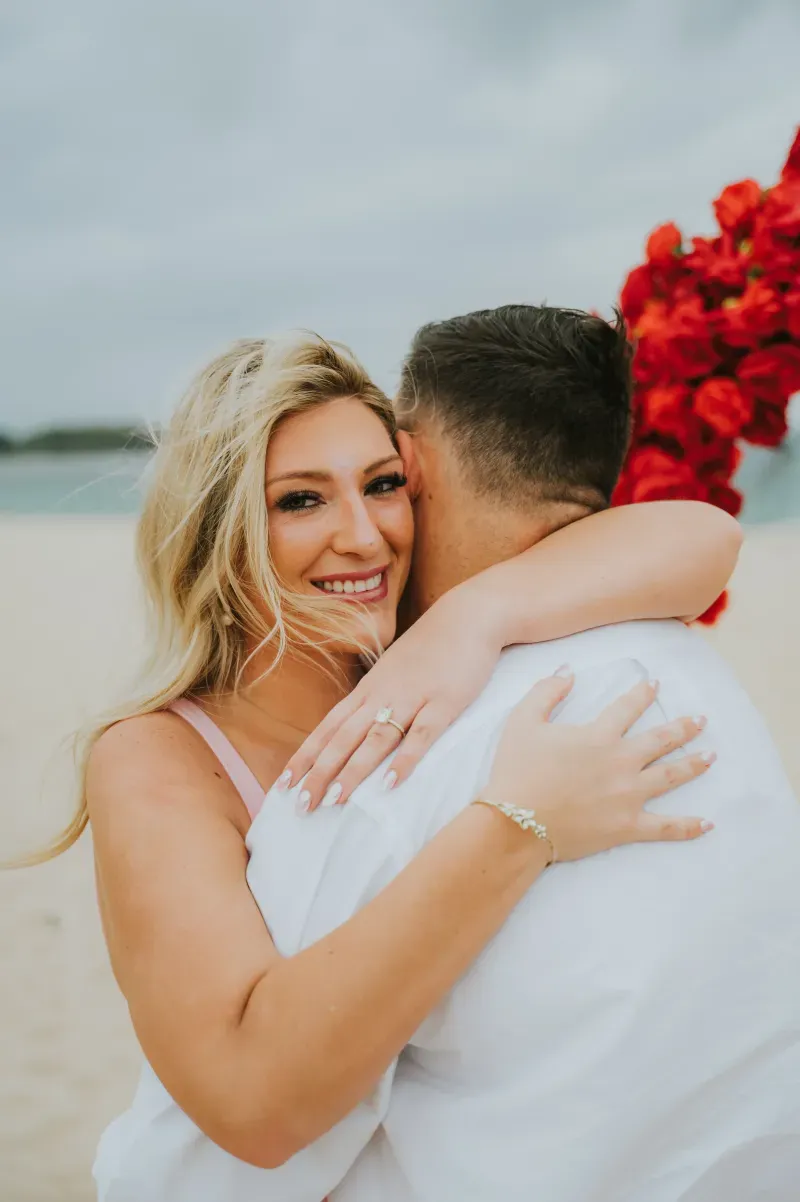 Happy engaged couple celebrating after surprise marriage proposal in Bali