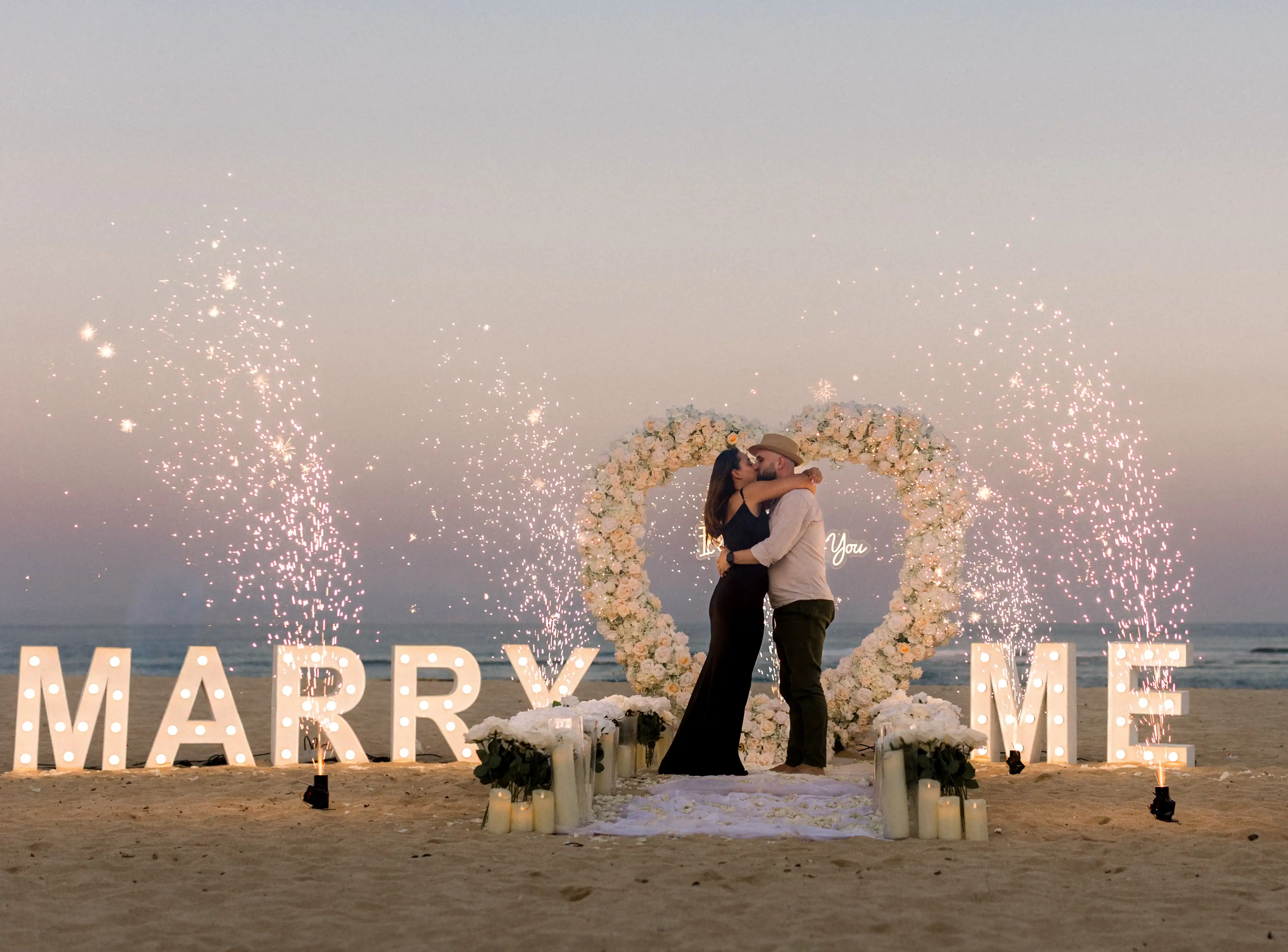 Happy engaged couple, beach proposal in Bali 