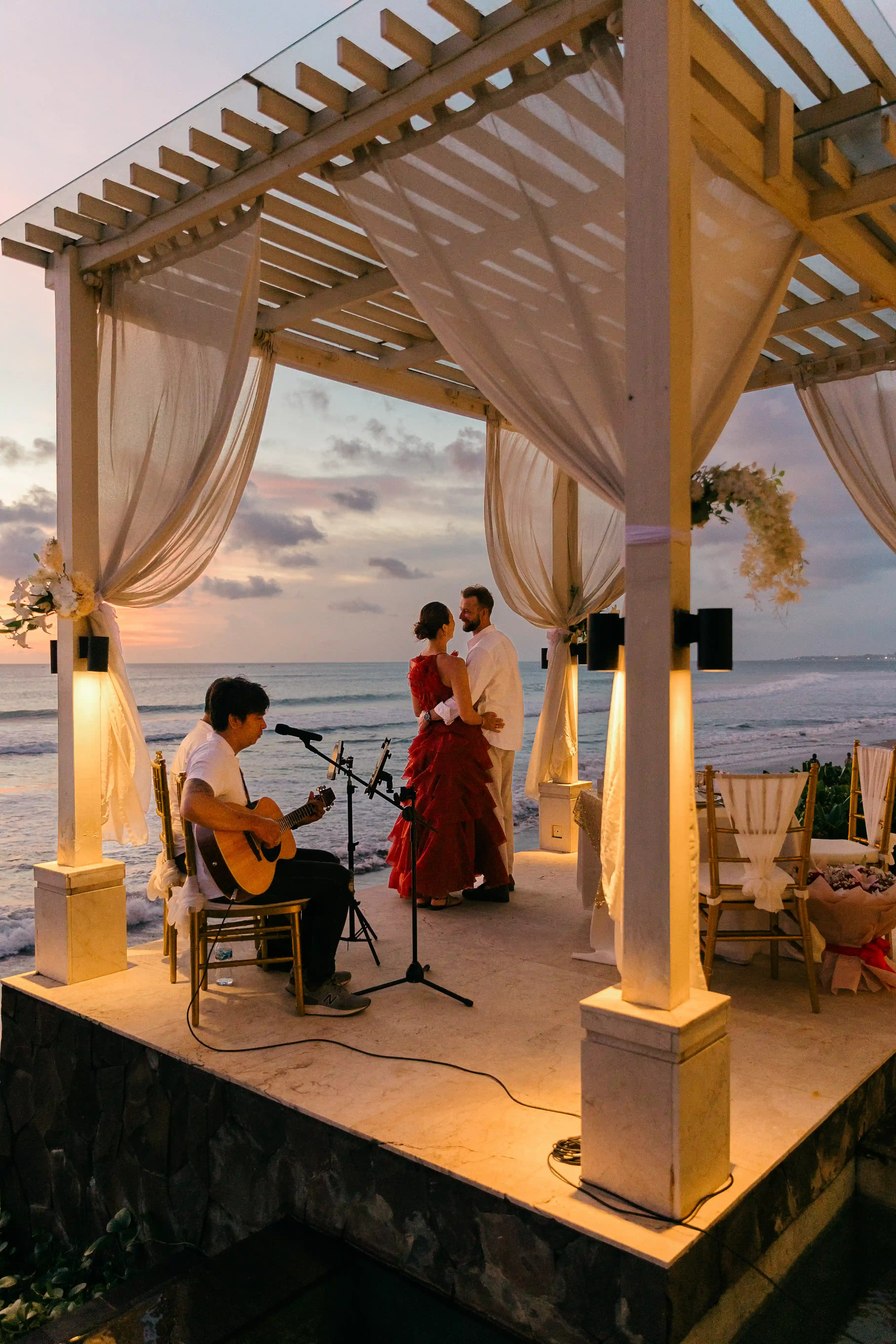 Just engaged couple at beach dinner proposal in Bali
