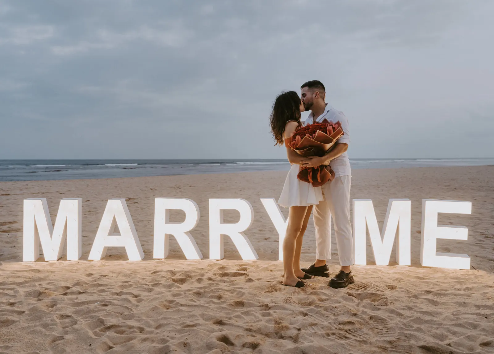 marry me neon letters on the bach