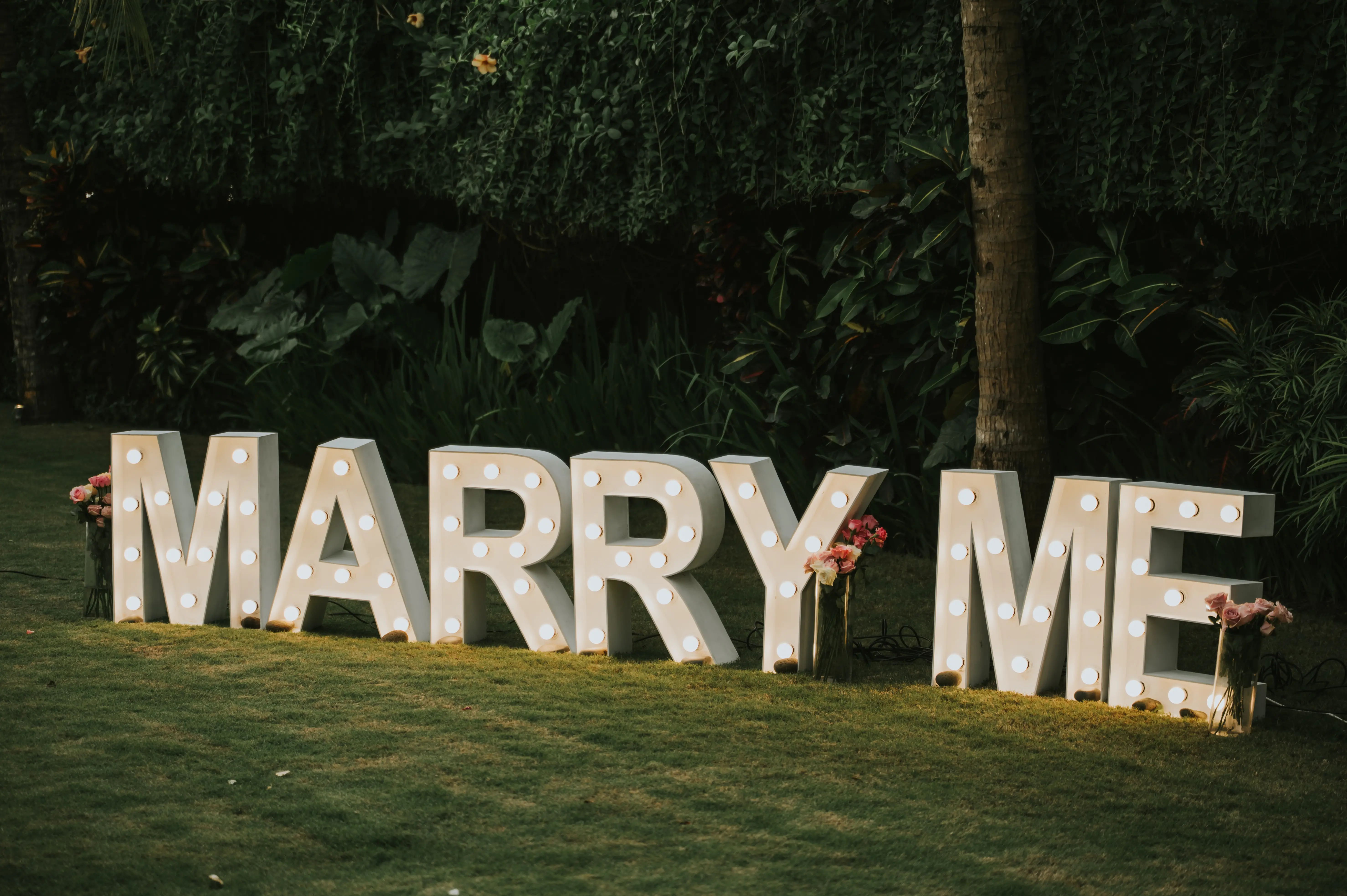 Marry Me light-up letters in Bali garden villa for romantic proposal