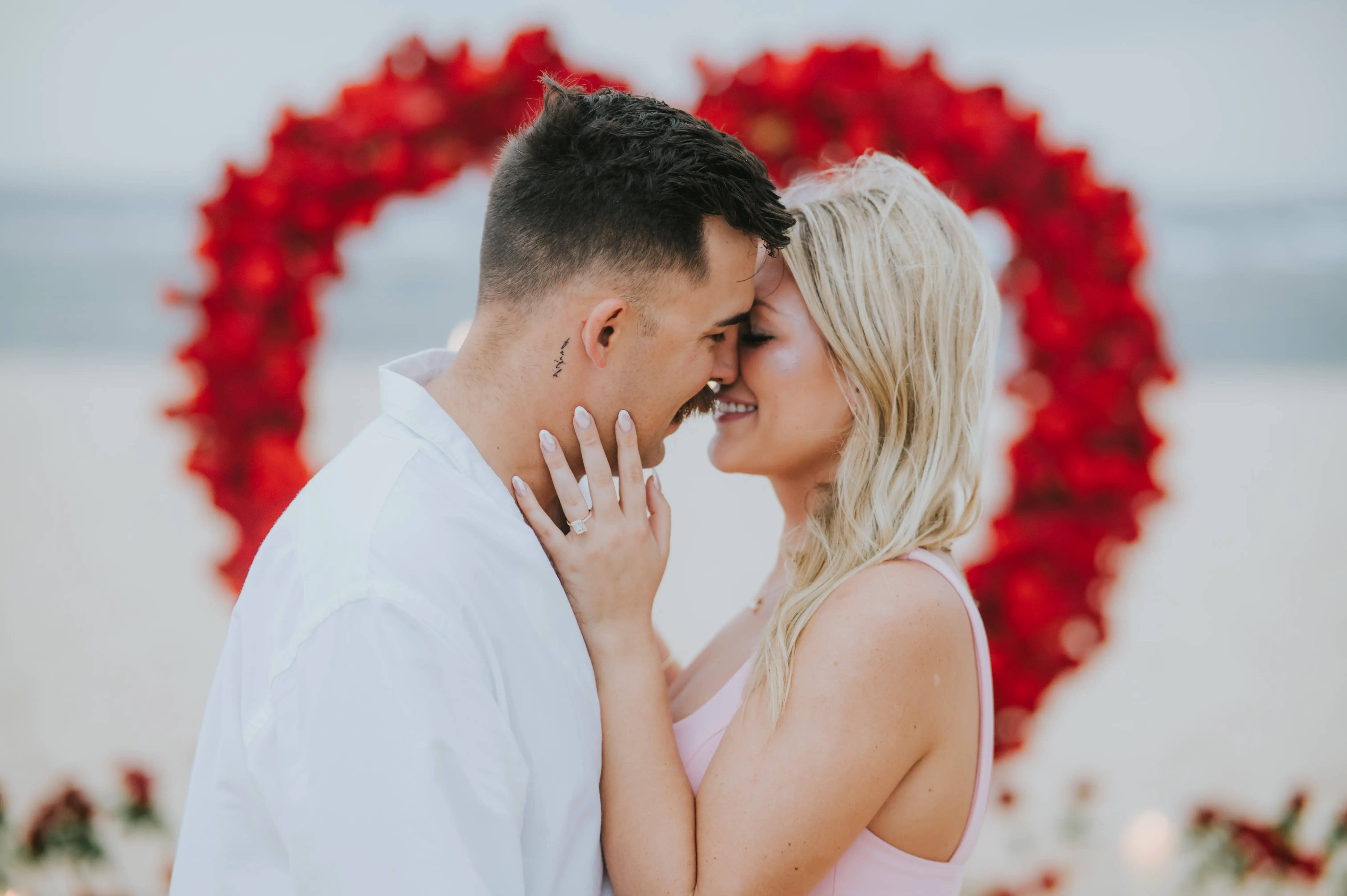 Happy couple embracing after beach proposal in Bali