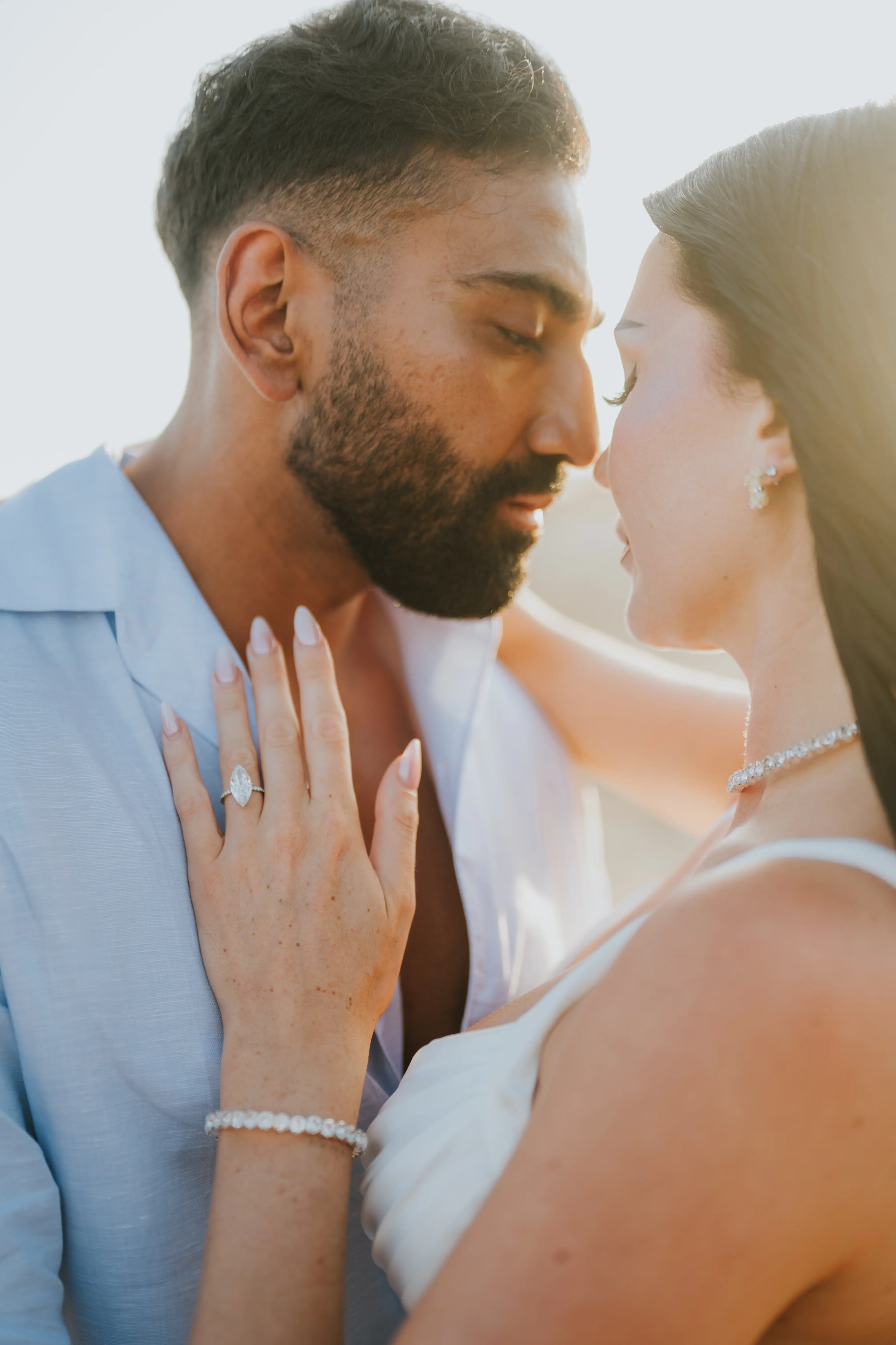Romantic close-up engagement moment at Bali beach proposal.
