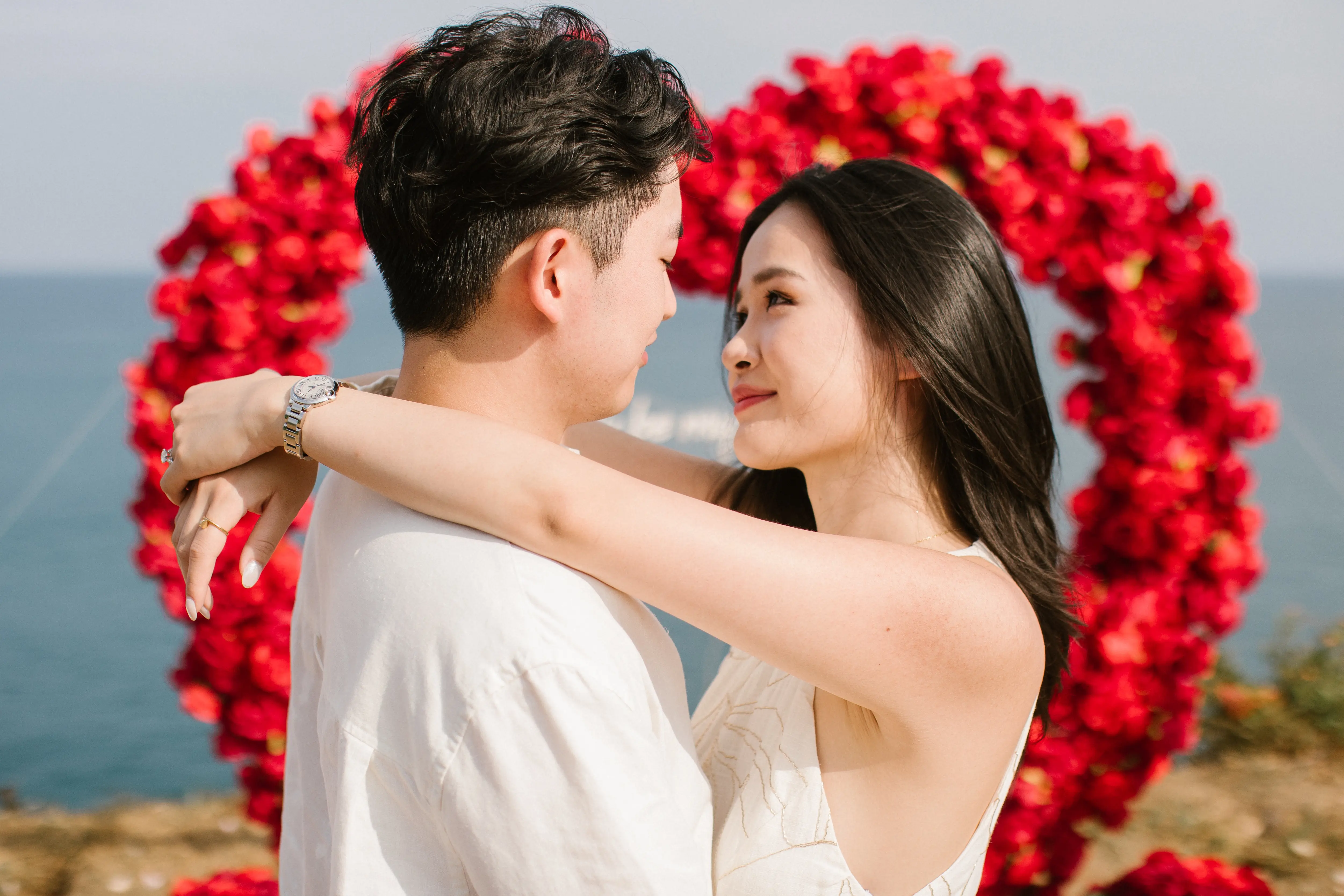 Couple engagement photoshoot on Bali cliff after proposal
