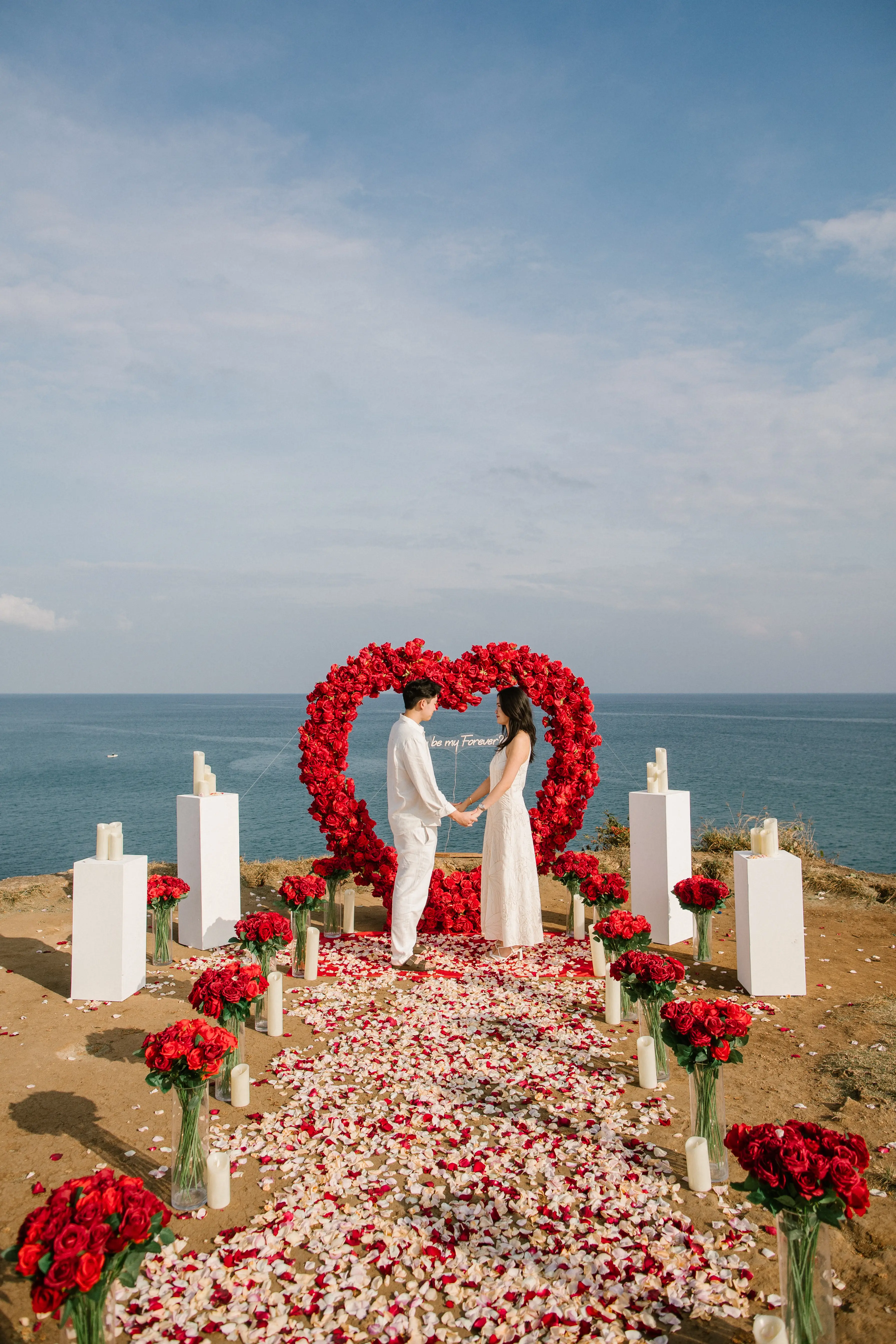 Happy engaged couple in Bali after a romantic cliff proposal