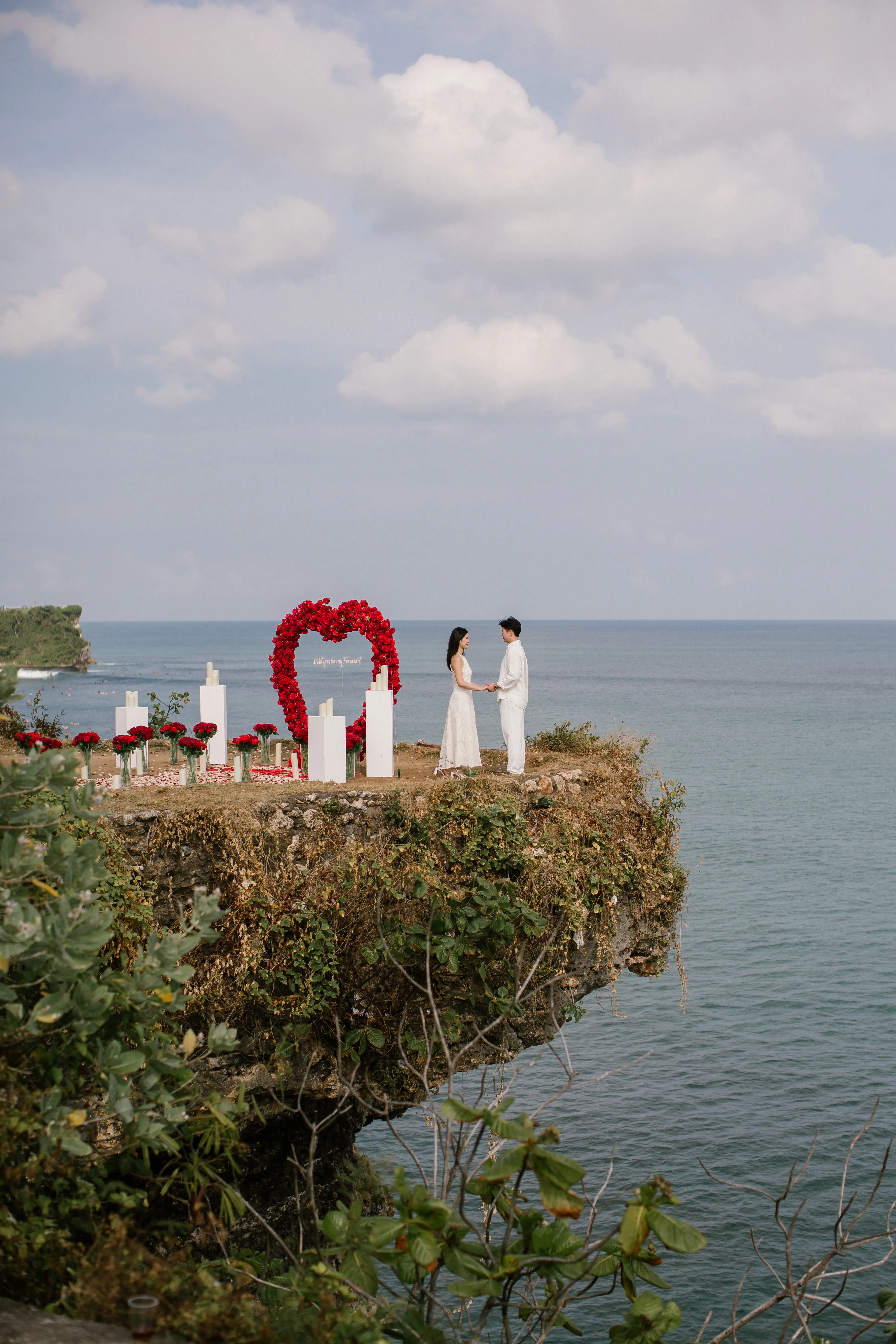 Sideview of romantic cliff proposal in Bali