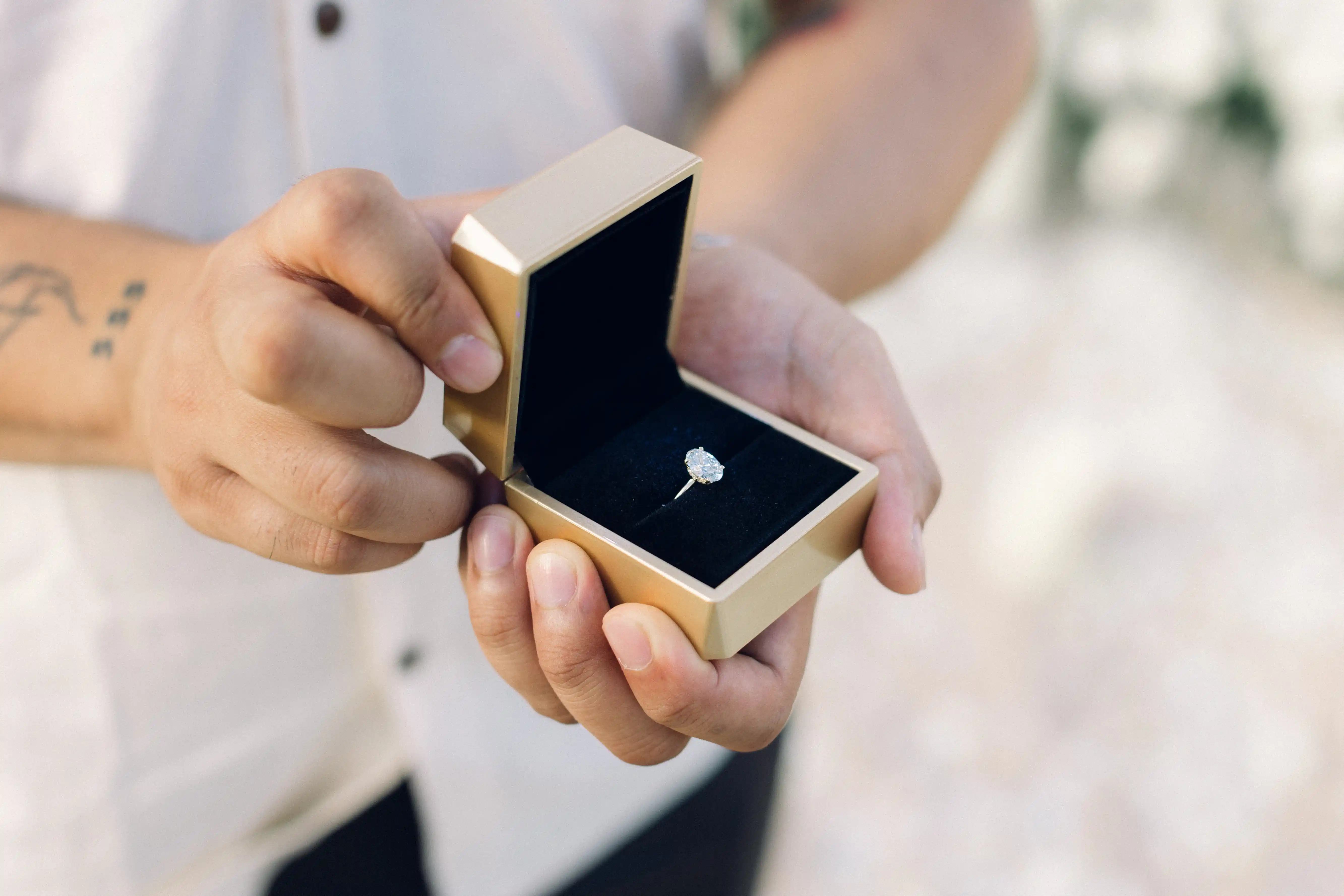 Man holding ring box during Bali proposal