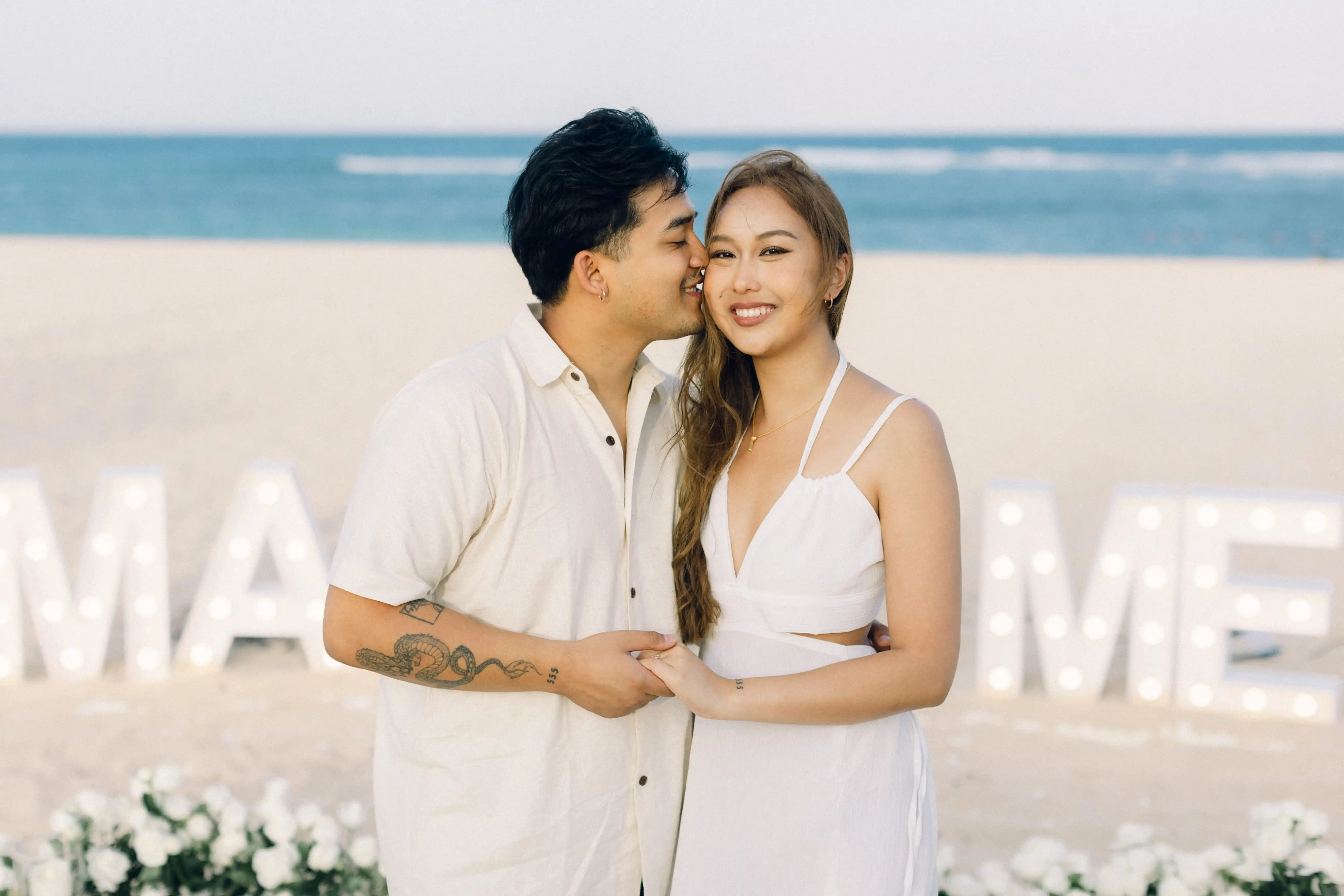 Engagement couple standing by Bali beach setup