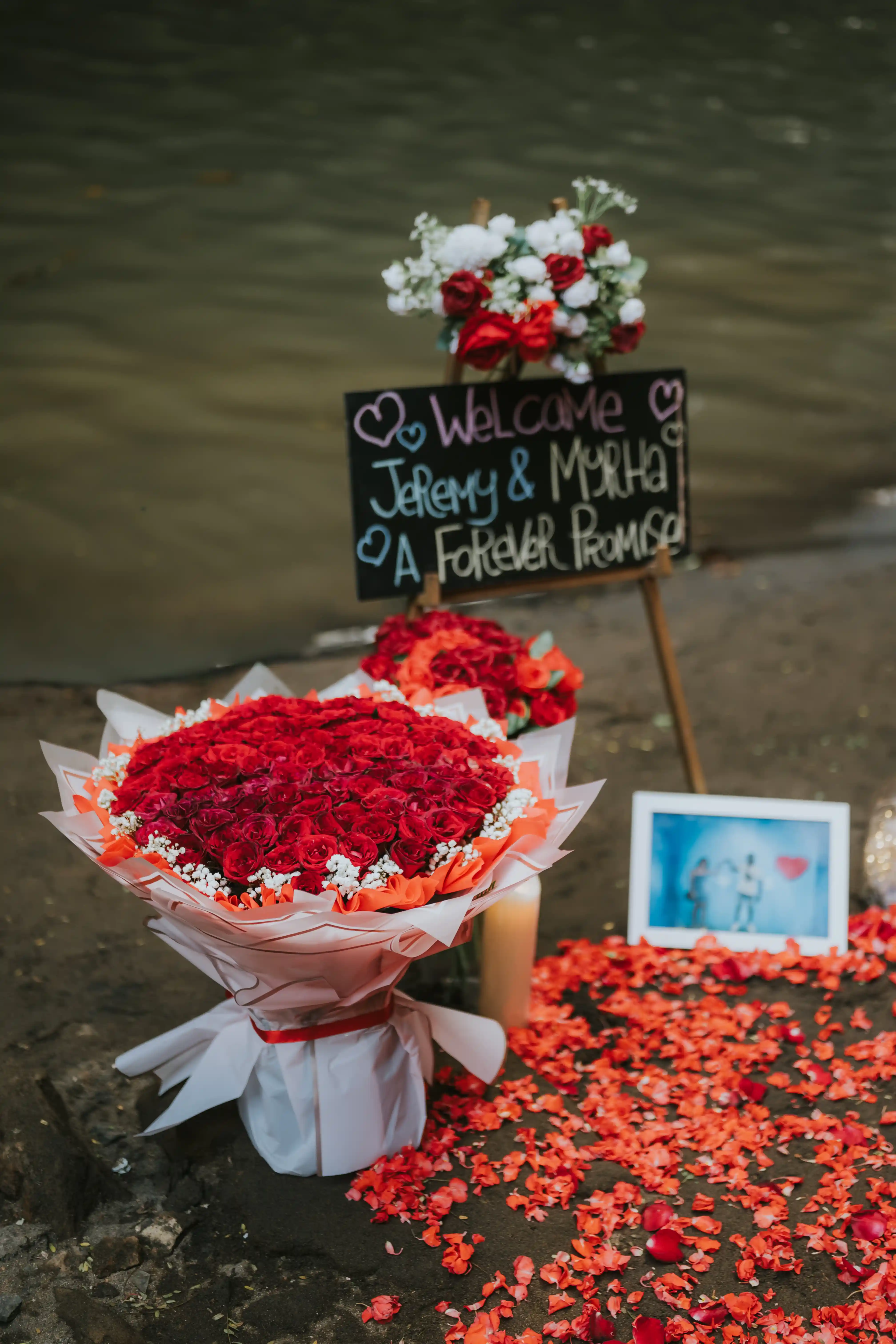 Proposal welcoming setup with flowers and pictures in Bali