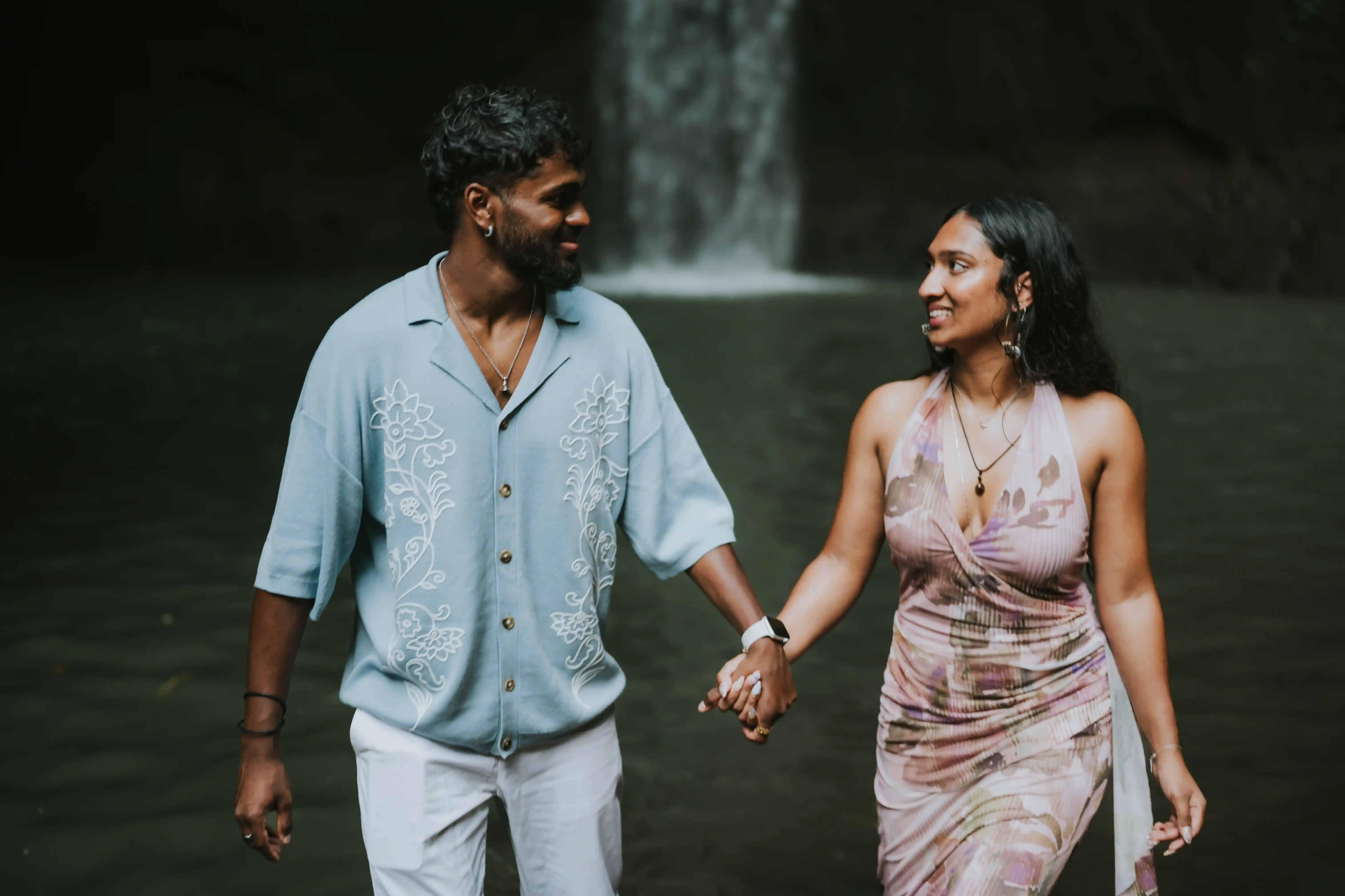 Happy engaged couple in Bali after waterfall proposal