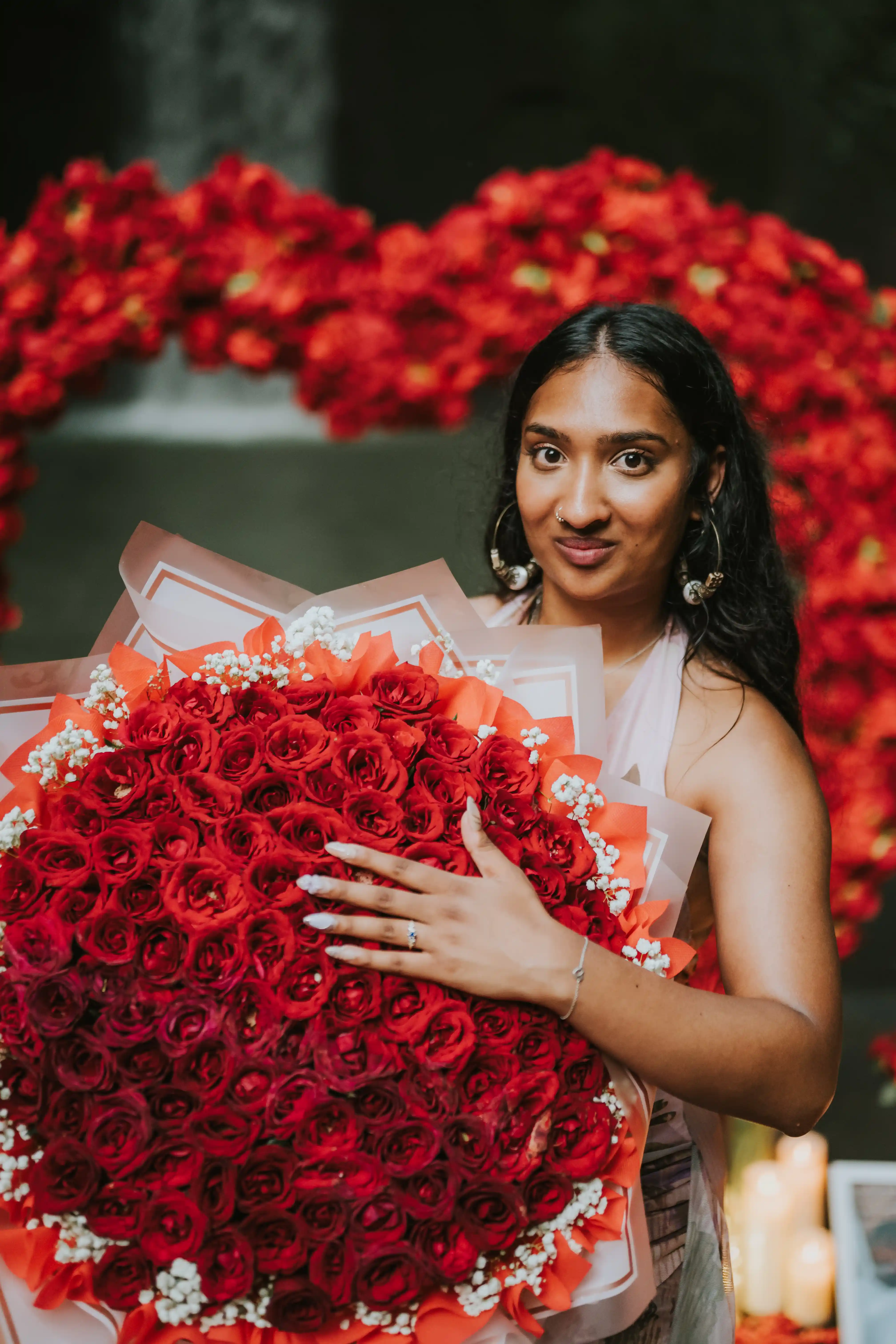 Bride-to-be holding bouquet after romantic proposal in Bali