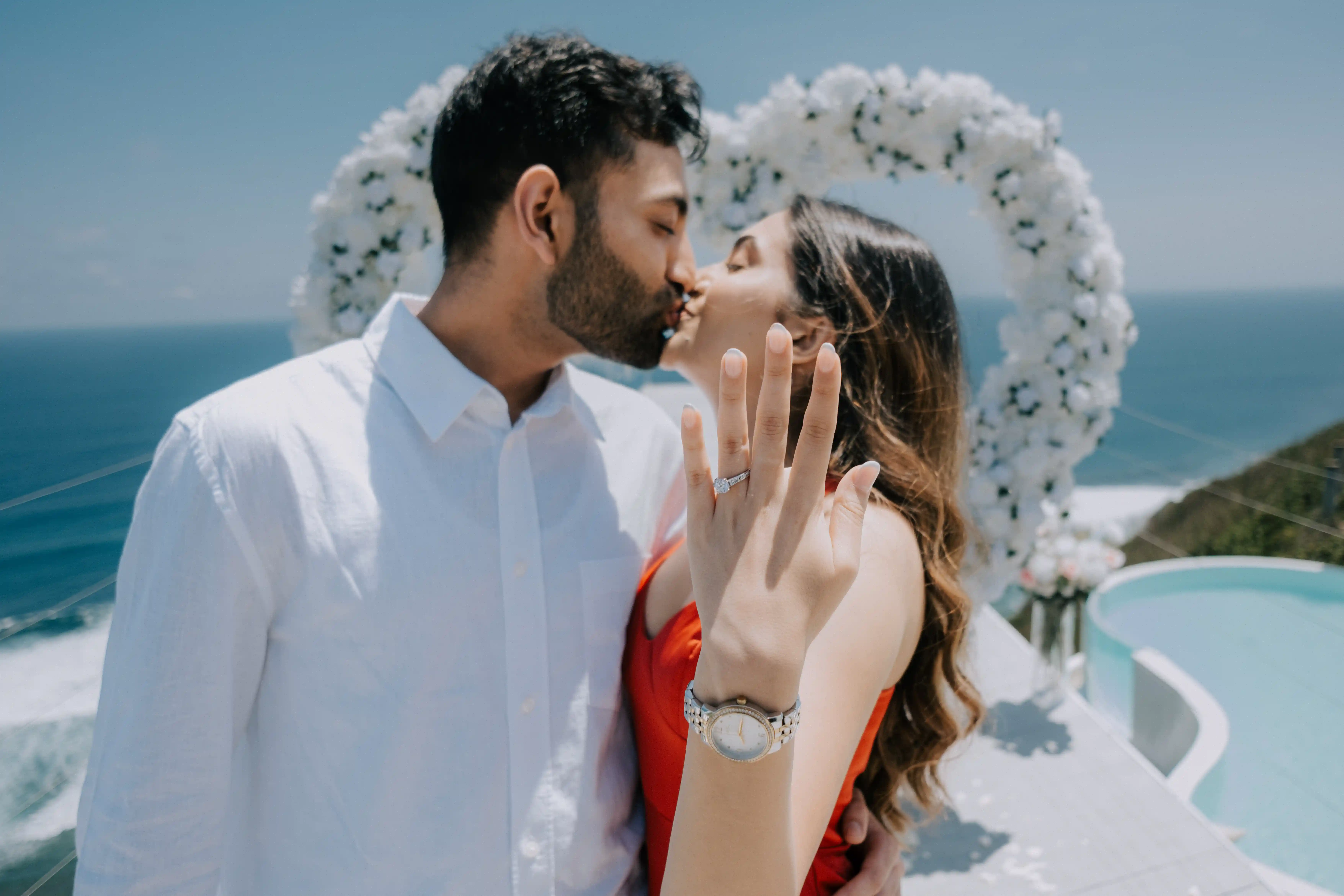 Just engaged couple in Bali celebrating their proposal by the sea.