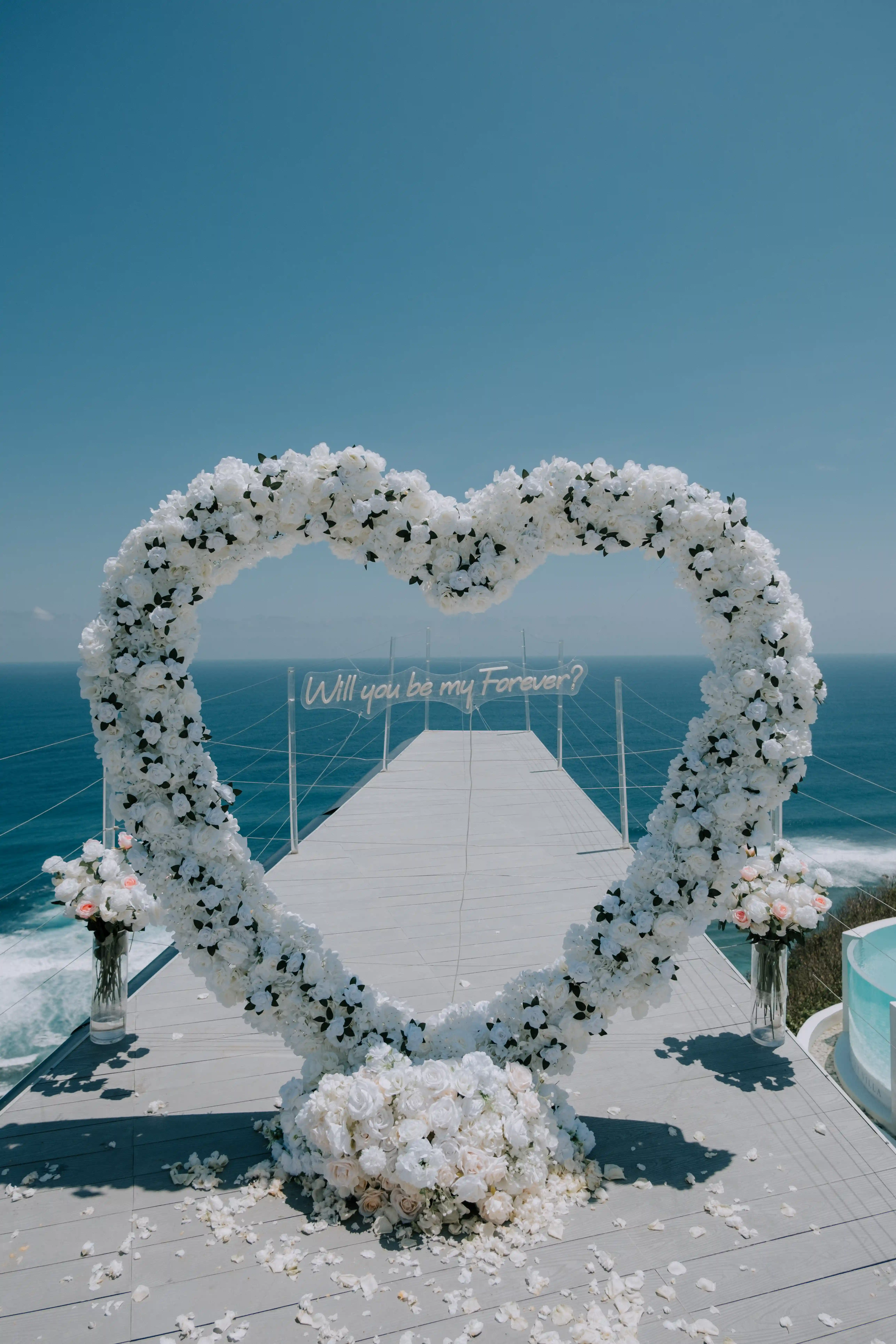 Heart-shaped floral arch for a romantic marriage proposal in Bali.