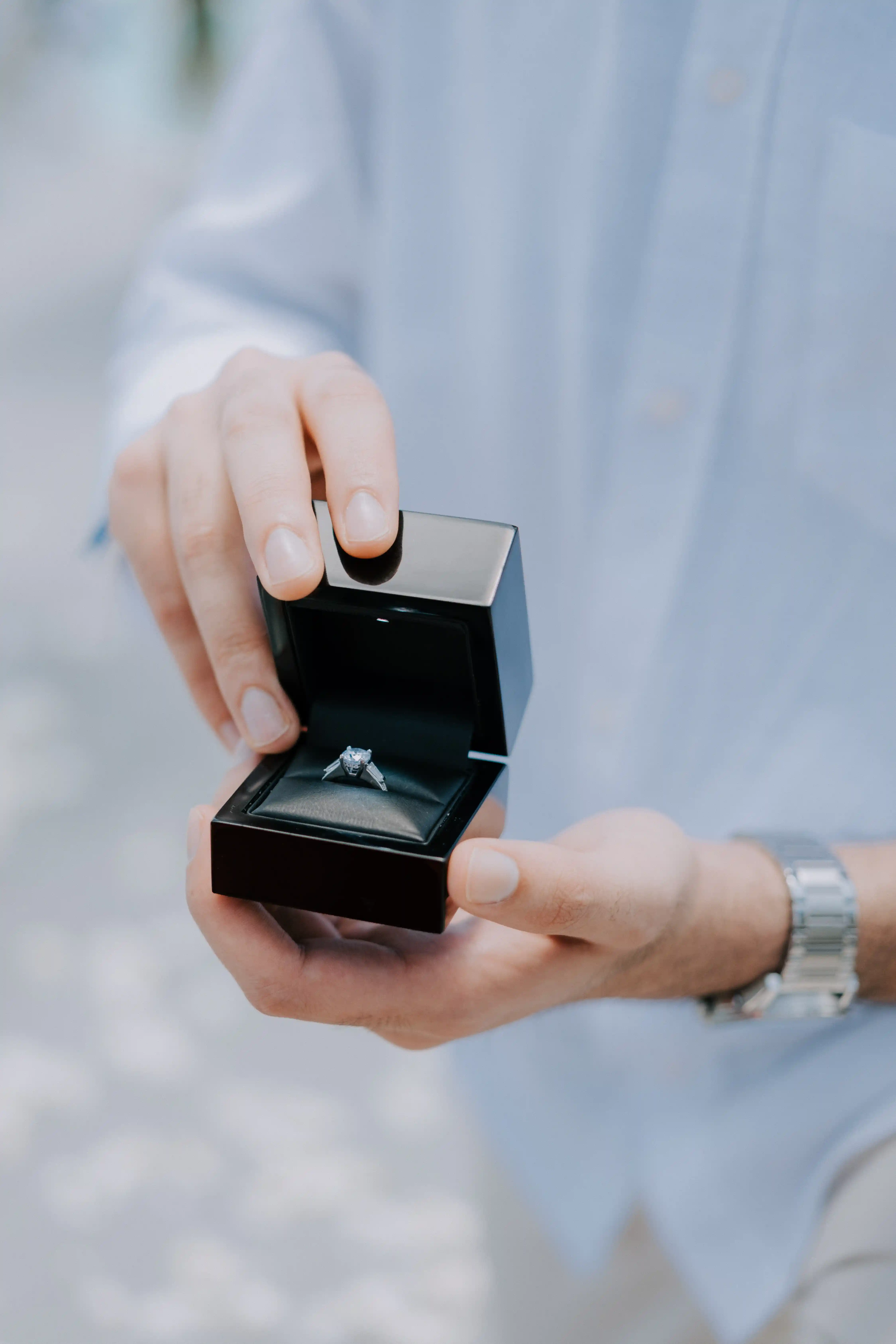 Close-up of engagement ring during a romantic Bali proposal.