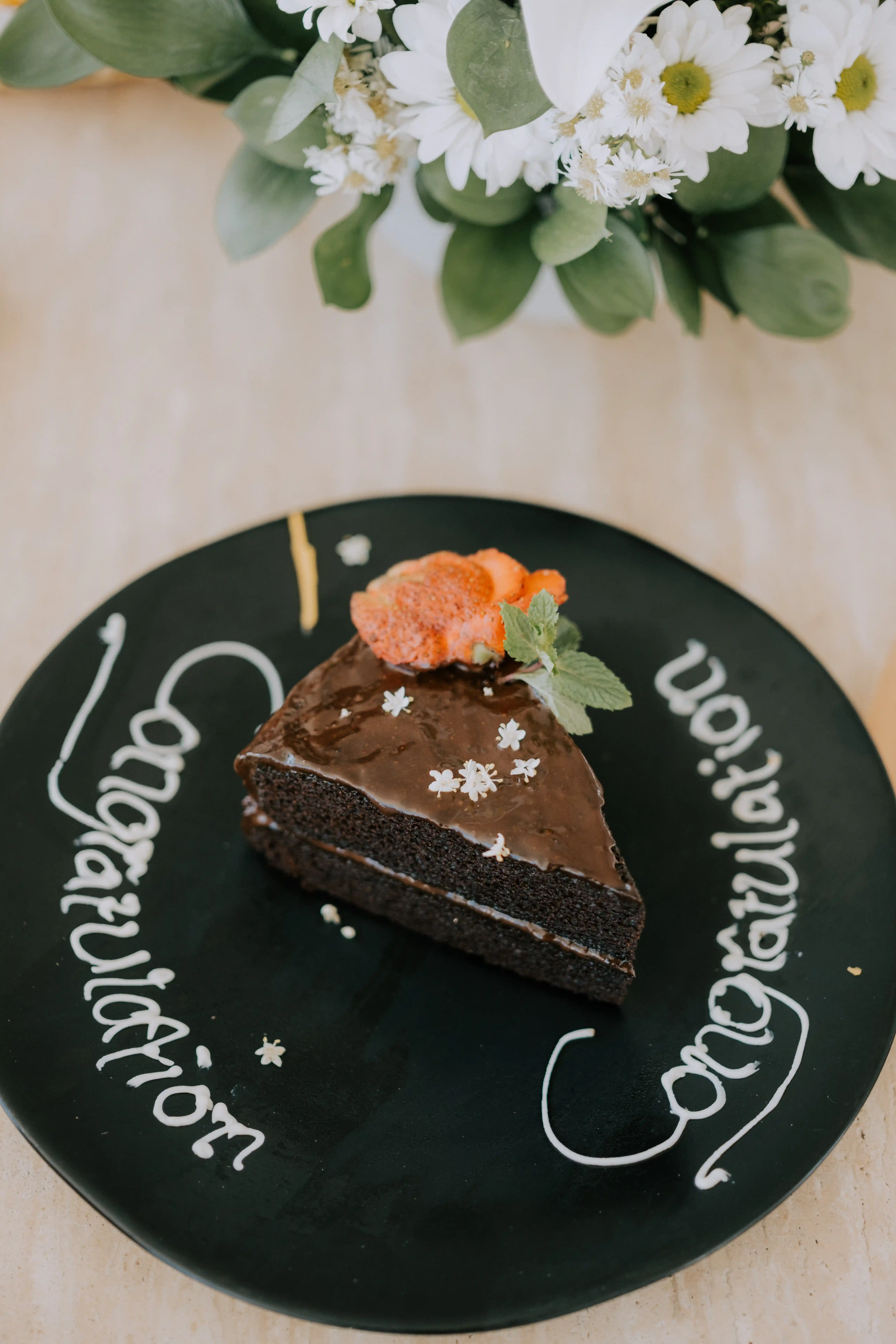 Celebration cake with “Congratulations” after engagement in Bali.