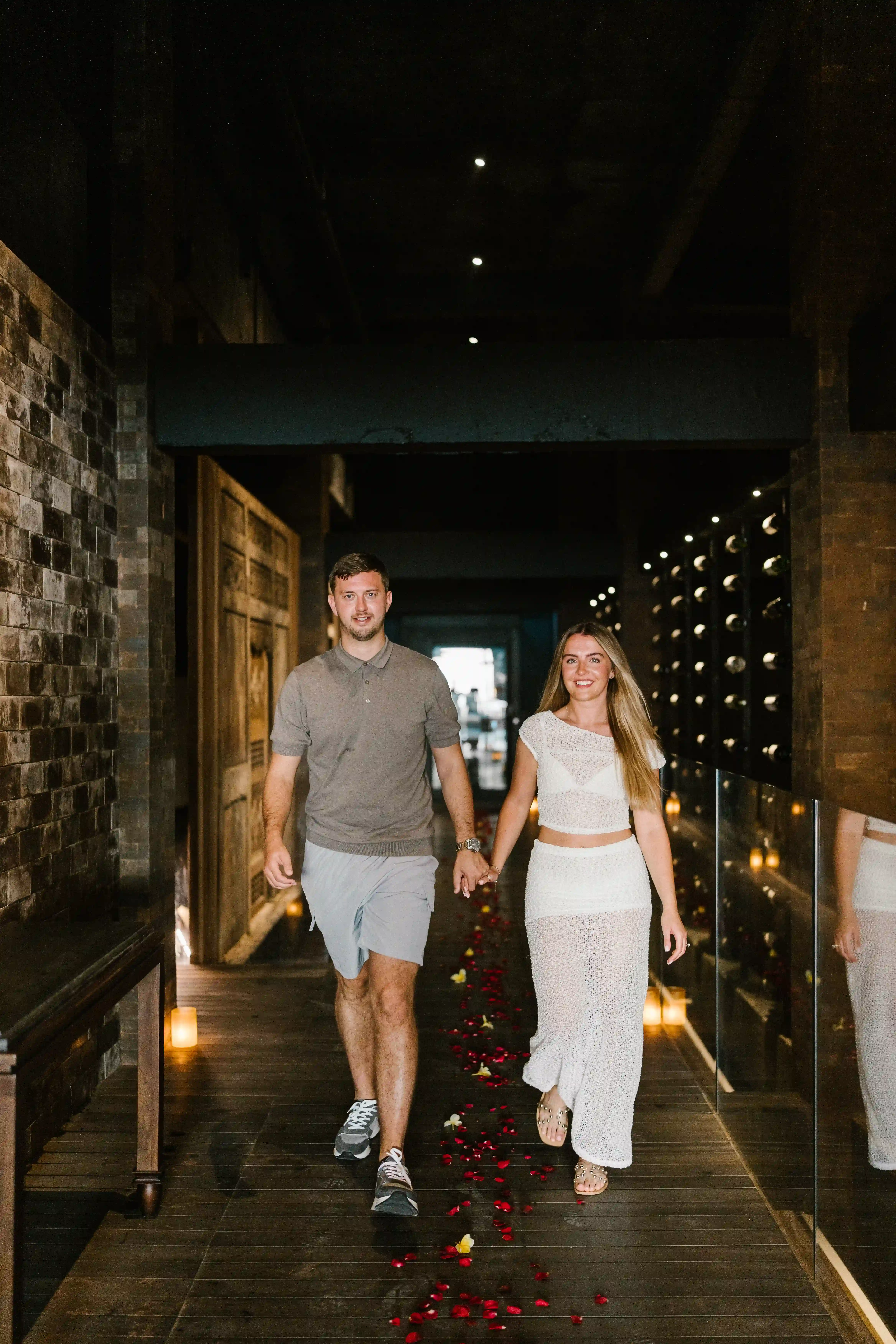 Just engaged in Bali – couple walking happily after proposal.