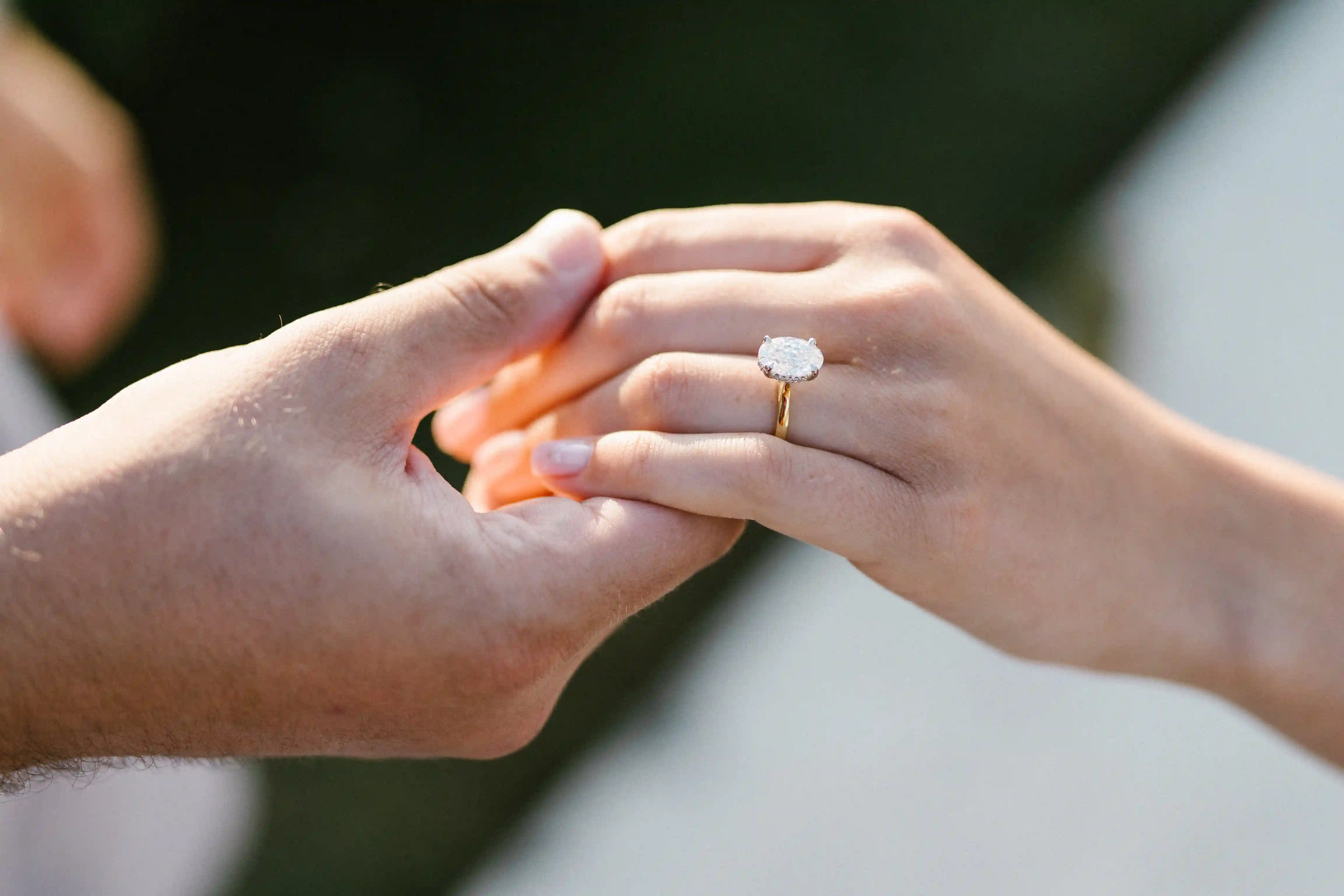 Close-up of engagement ring during marriage proposal in Bali.