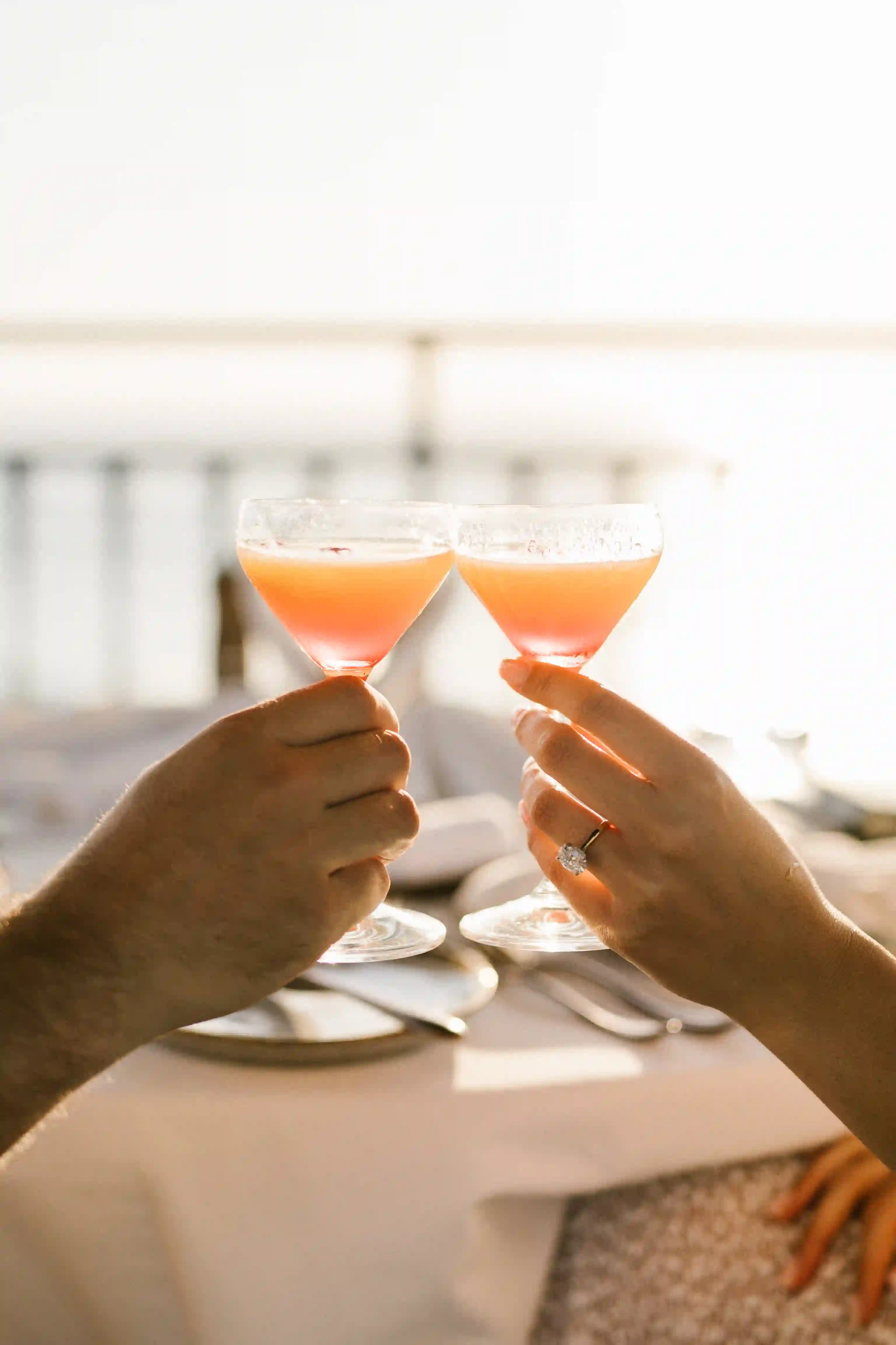 Celebration with cocktails after a romantic Bali engagement proposal.