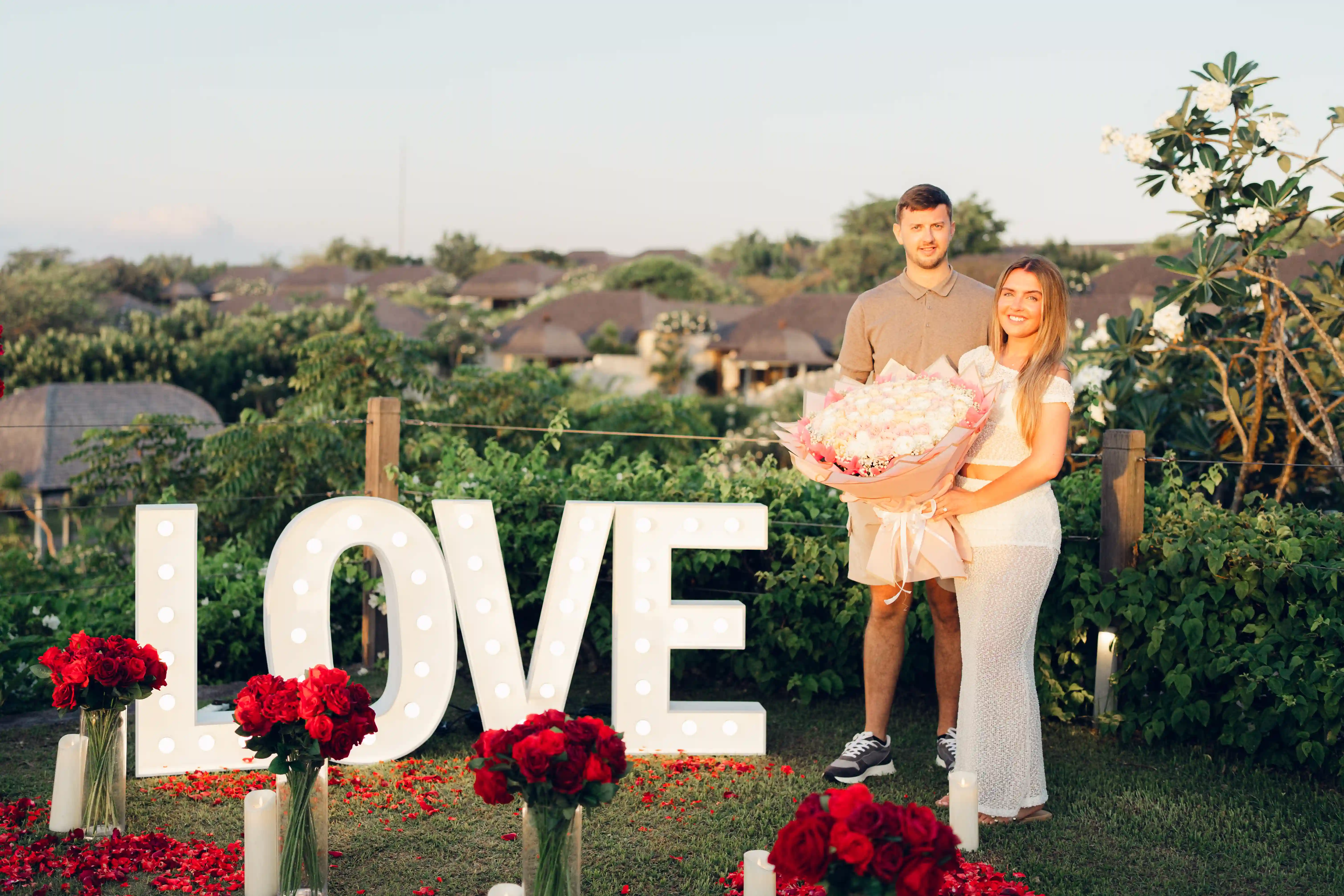 Exclusive Bali marriage proposal with rose arch and ocean view.