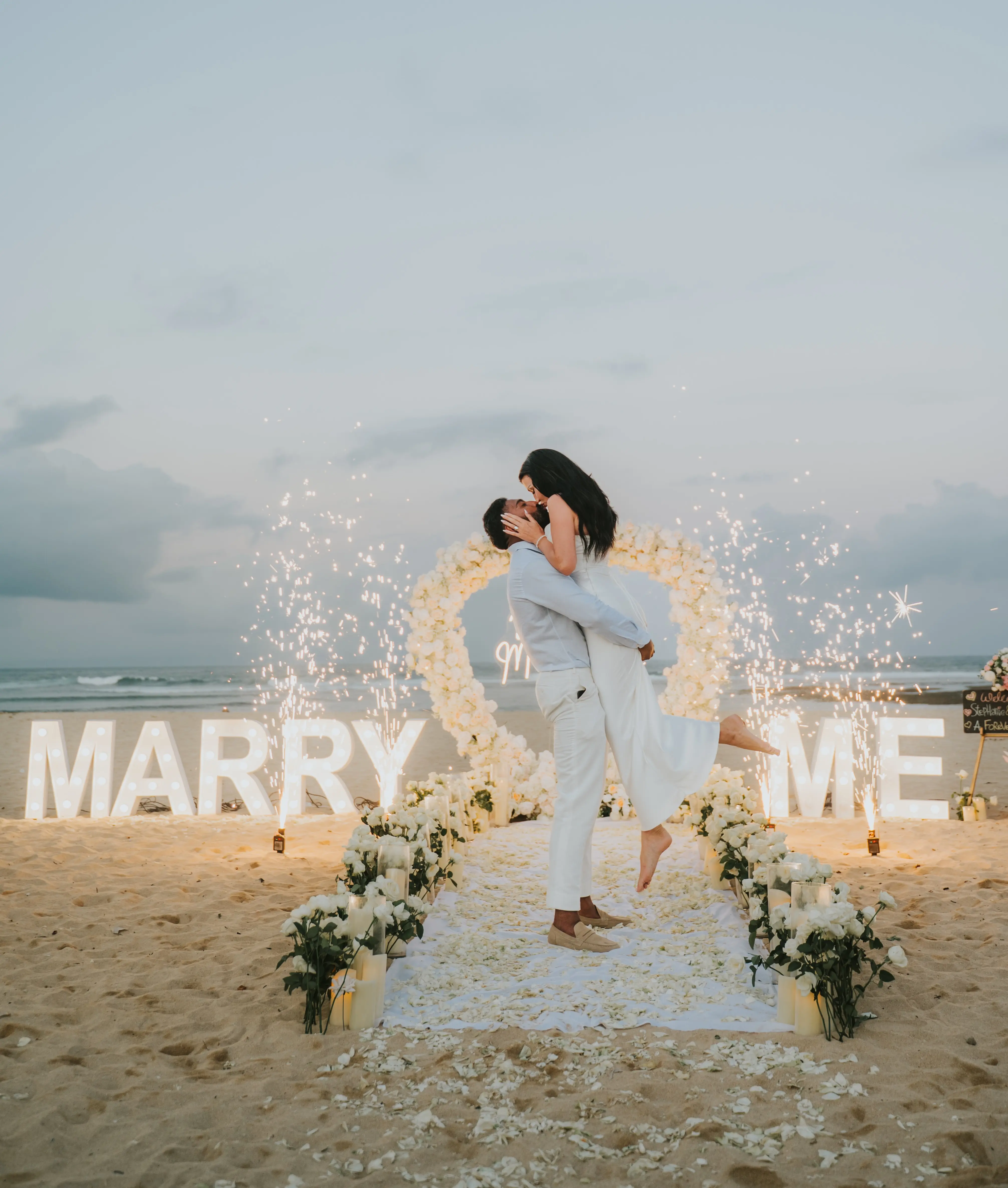 Marriage proposal by the beach at sunset