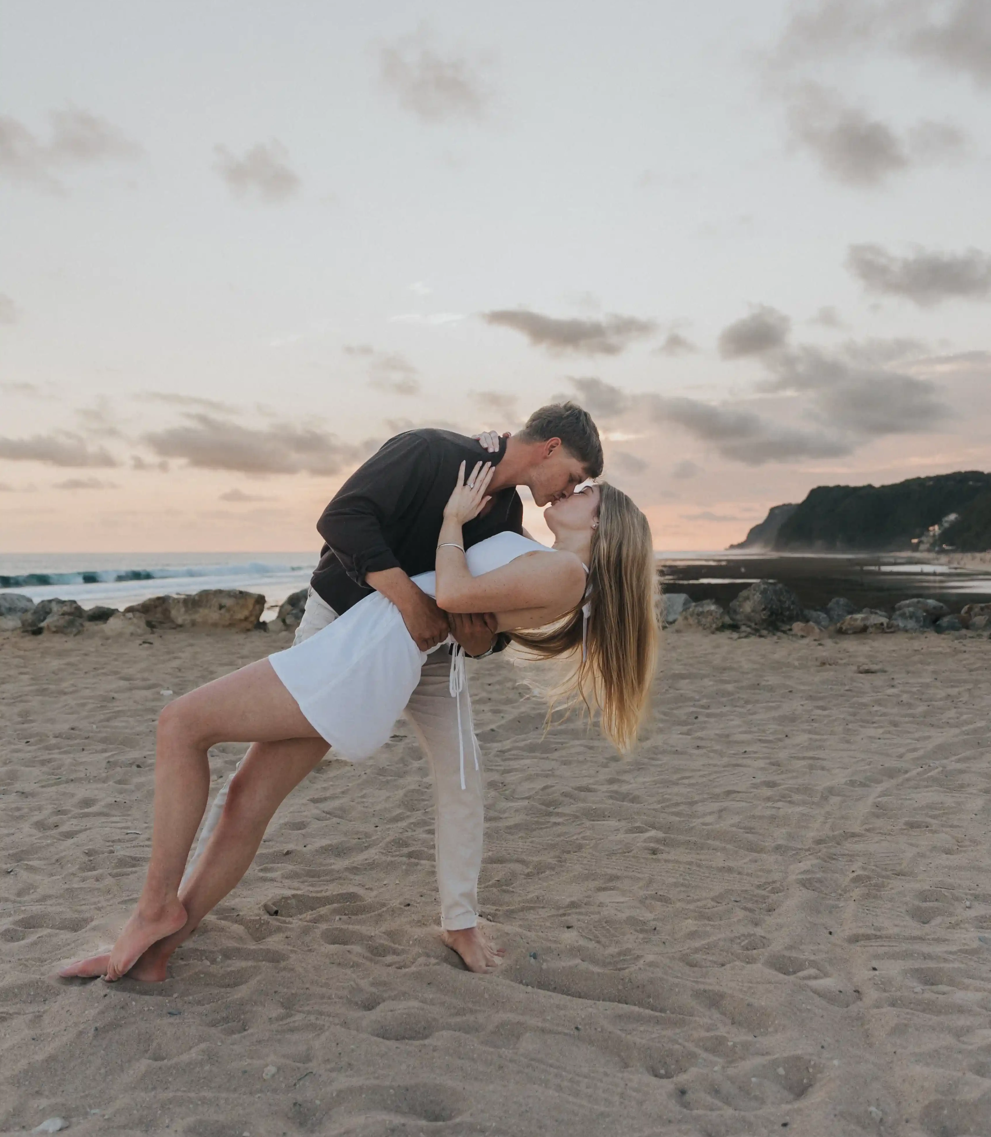 Couple celebrating their engagement on the beach in Bali.