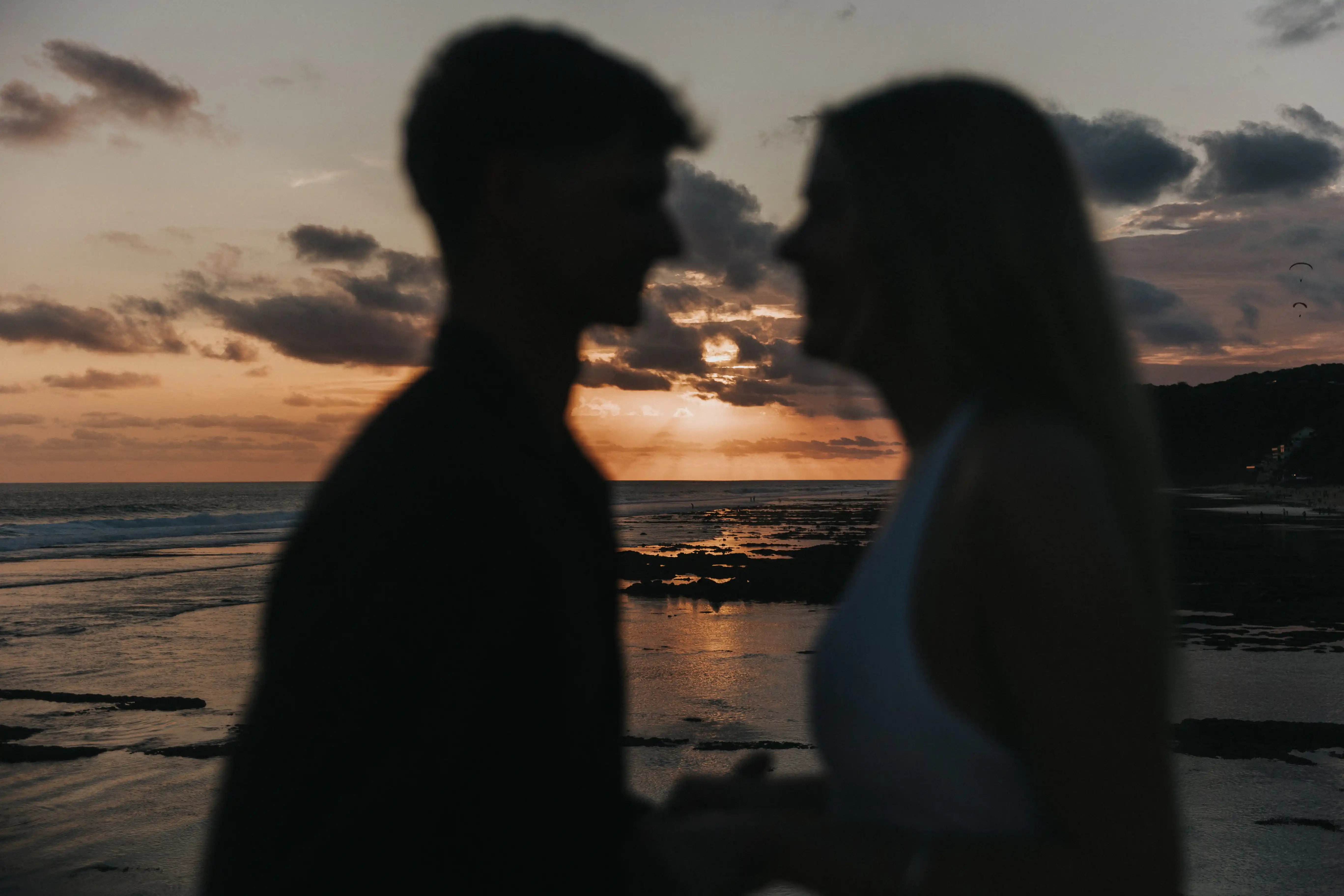 Couple sunset photography at the beach in Bali.