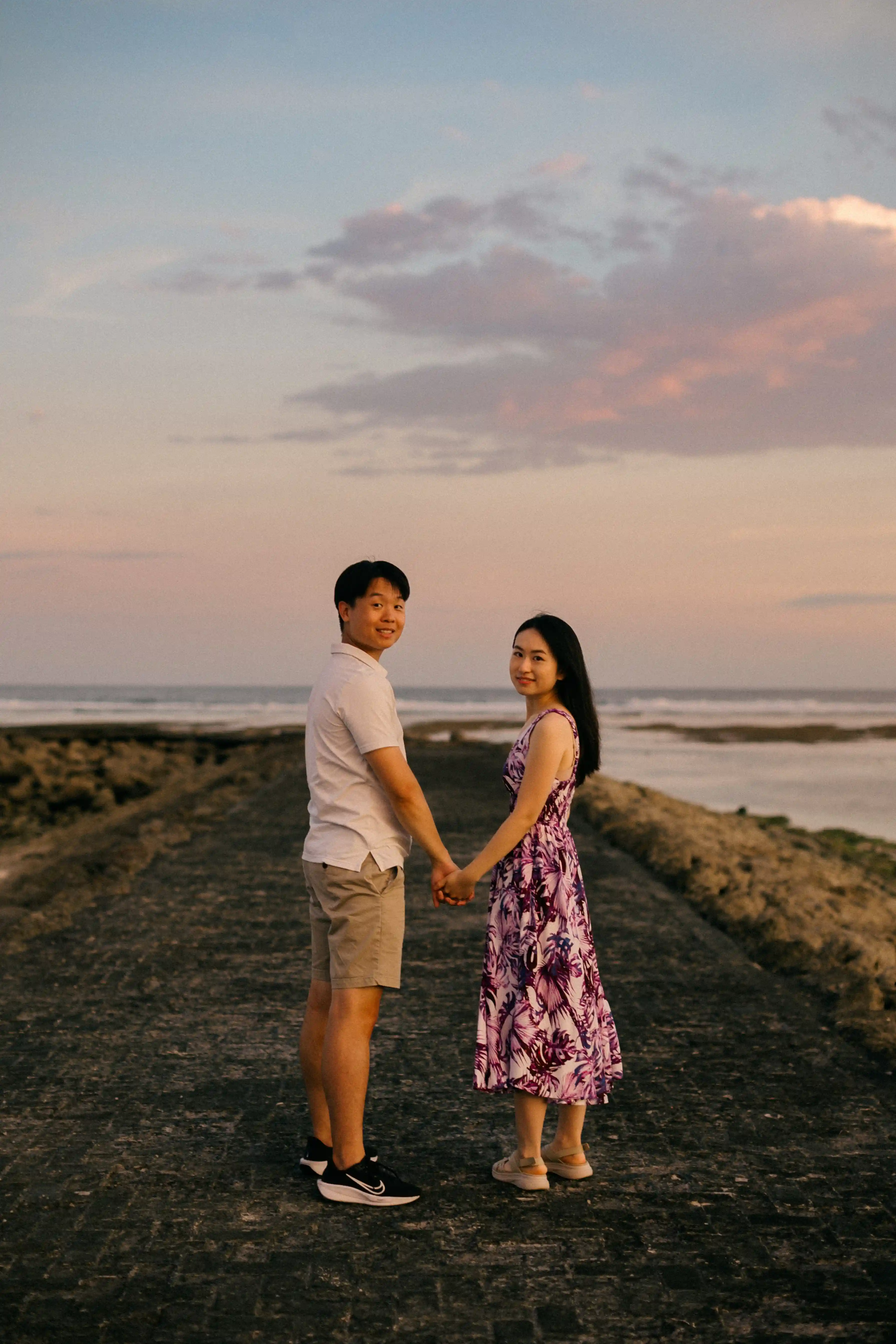 Just engaged couple celebrating on the beach in Bali.