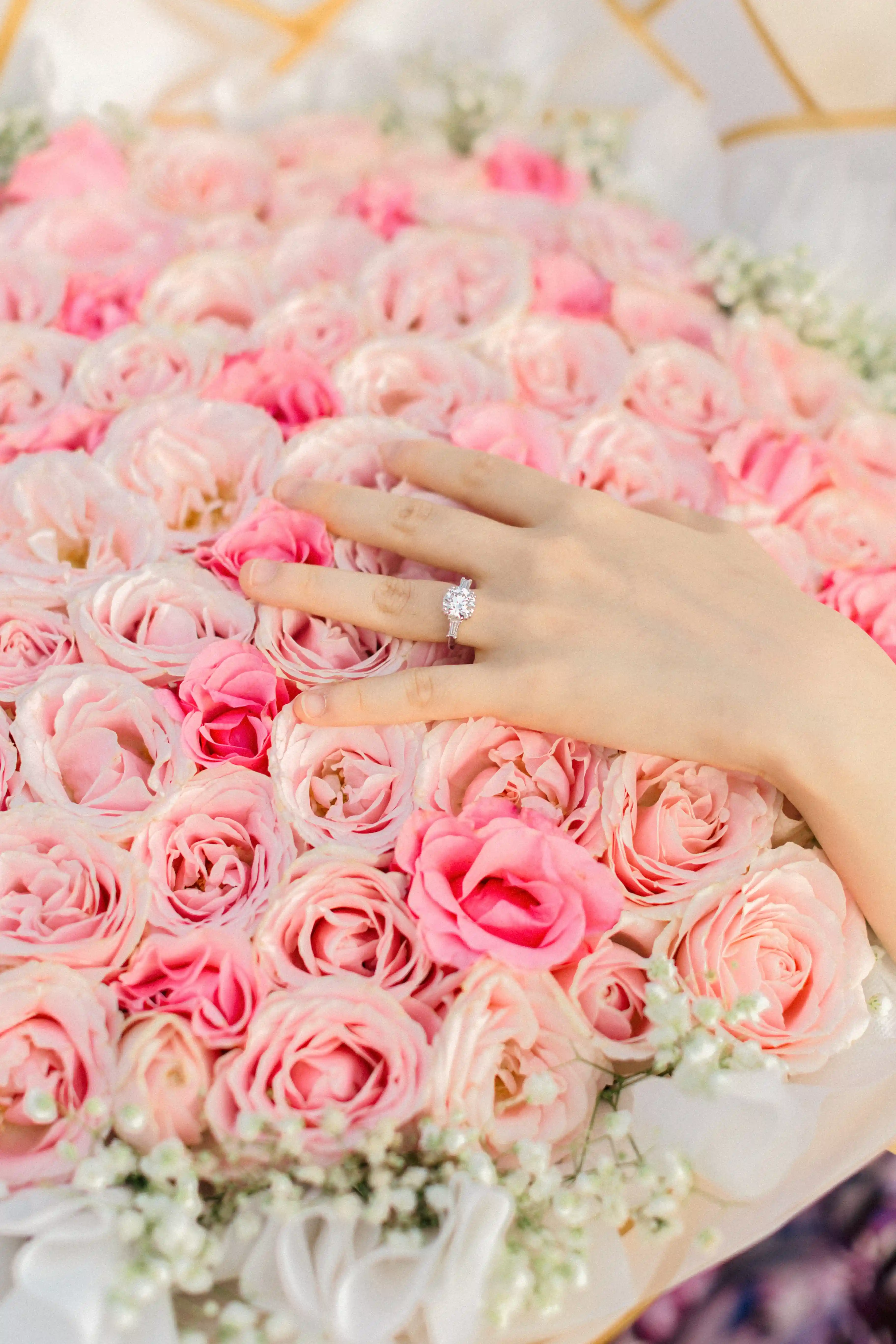 Close-up of pink rose heart arch used in Bali proposal setup.