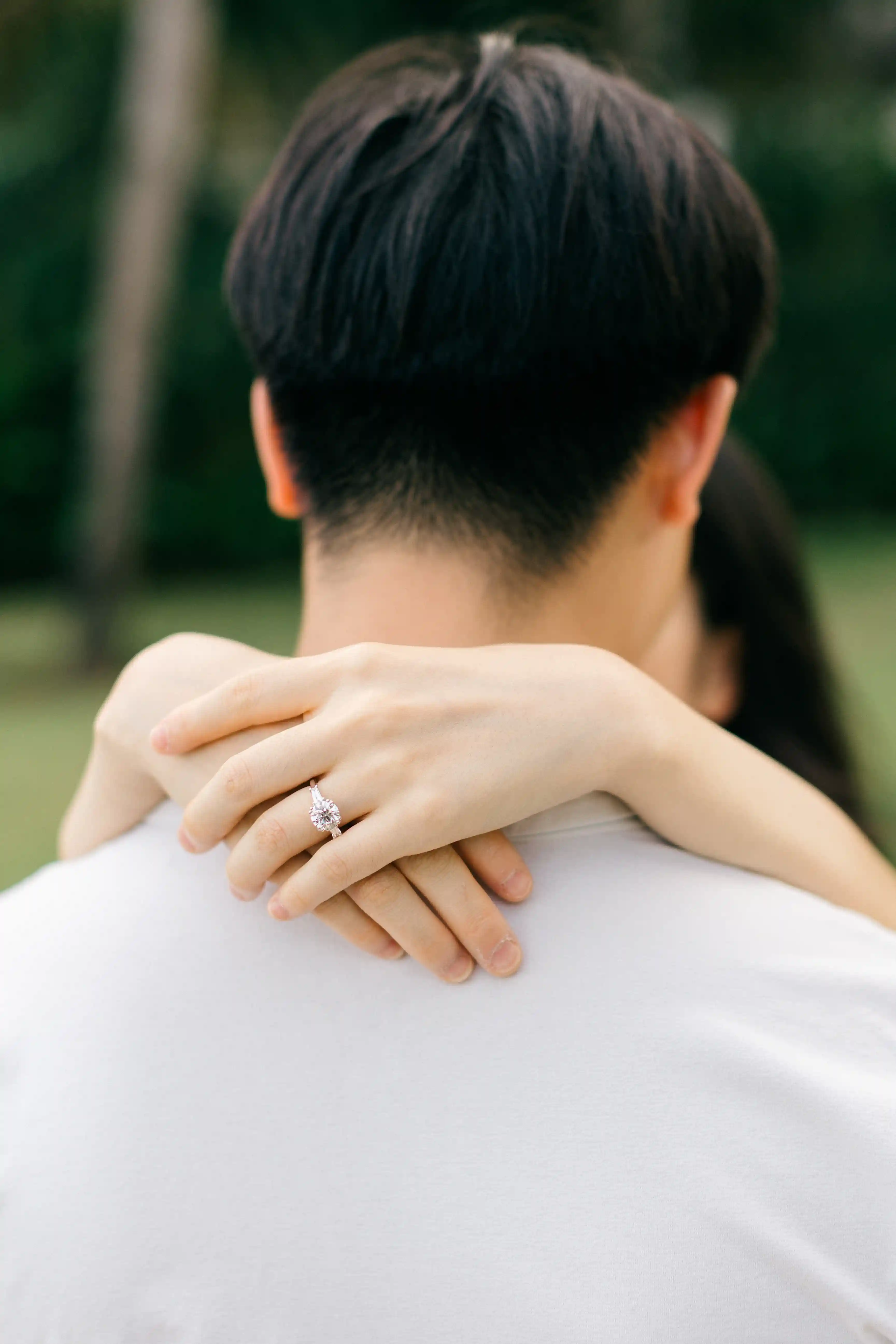 Close-up of engagement ring during Bali beach proposal.