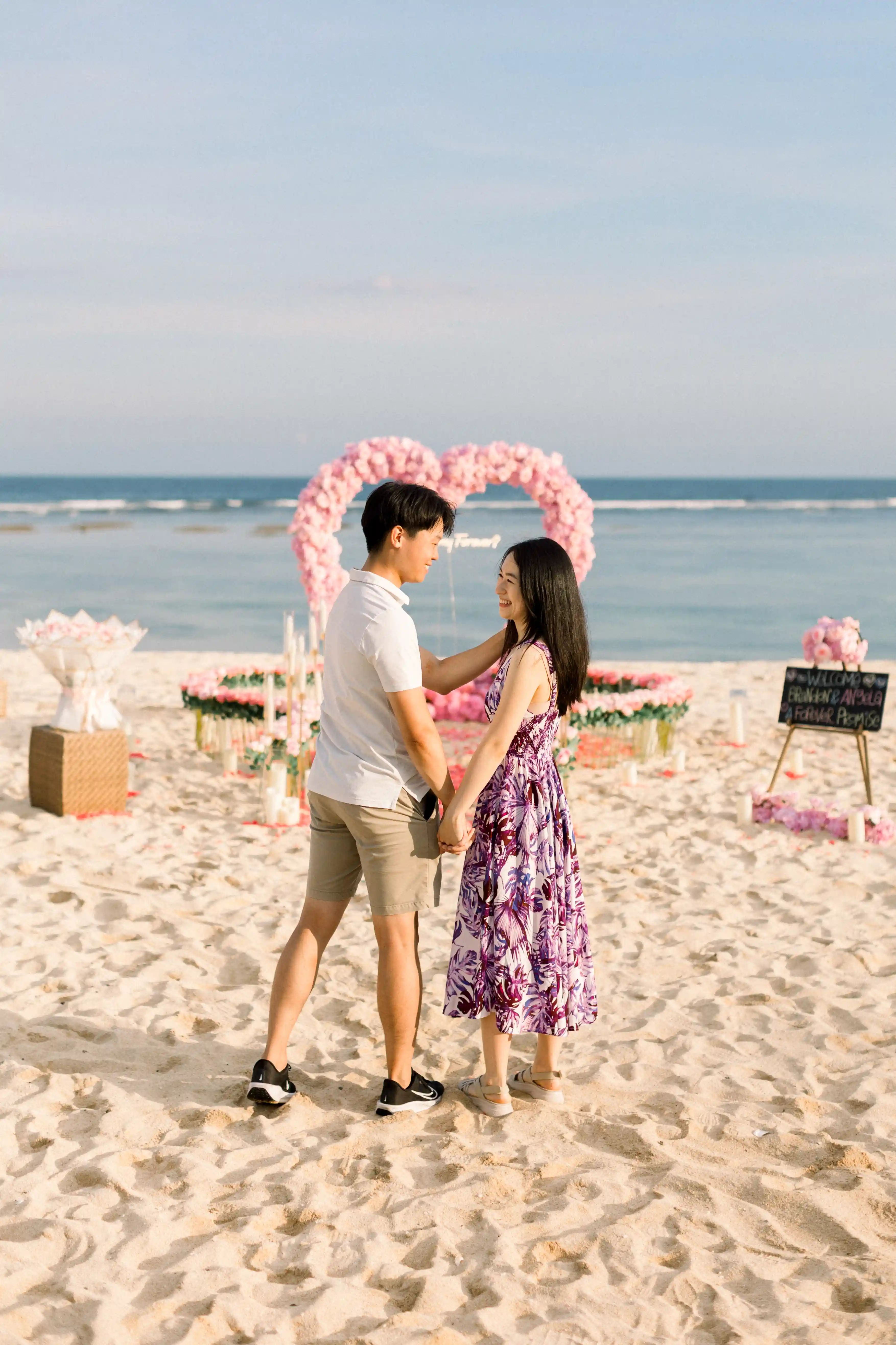 Romantic floral heart arch setup for a proposal in Bali.