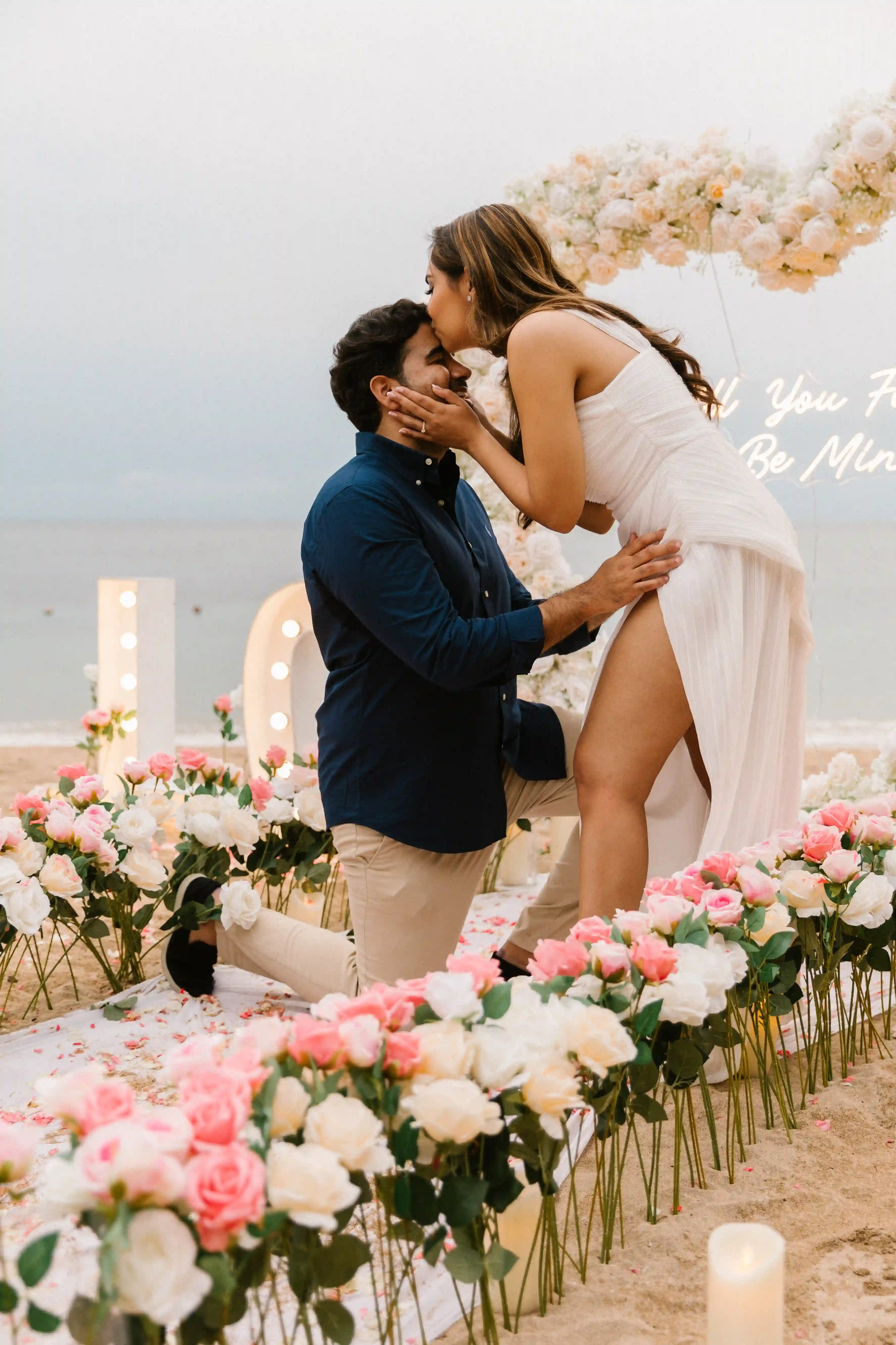 Romantic couple moment during a professionally planned beach proposal in Bali