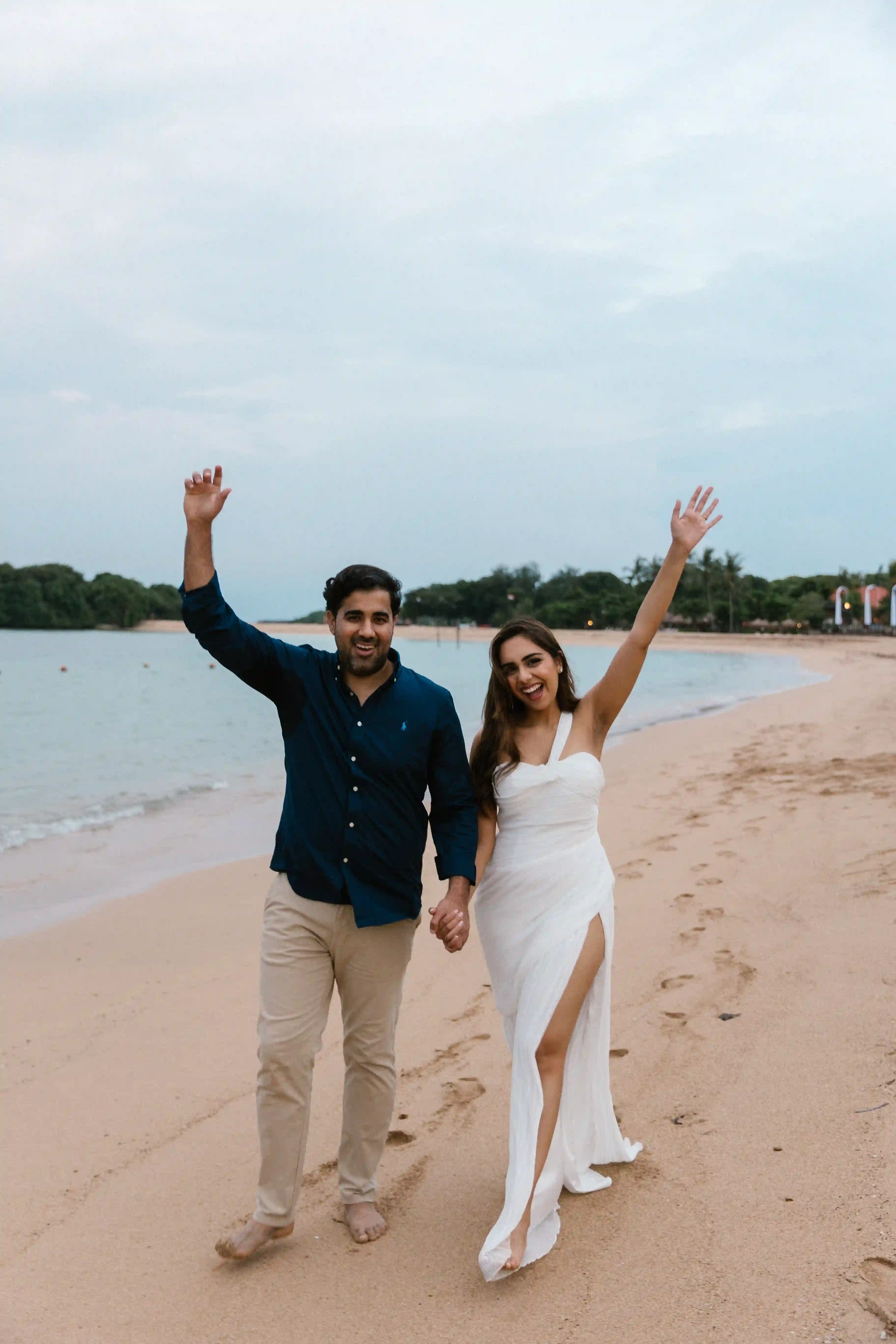 Celebratory moment after a luxury marriage proposal on a Bali beach