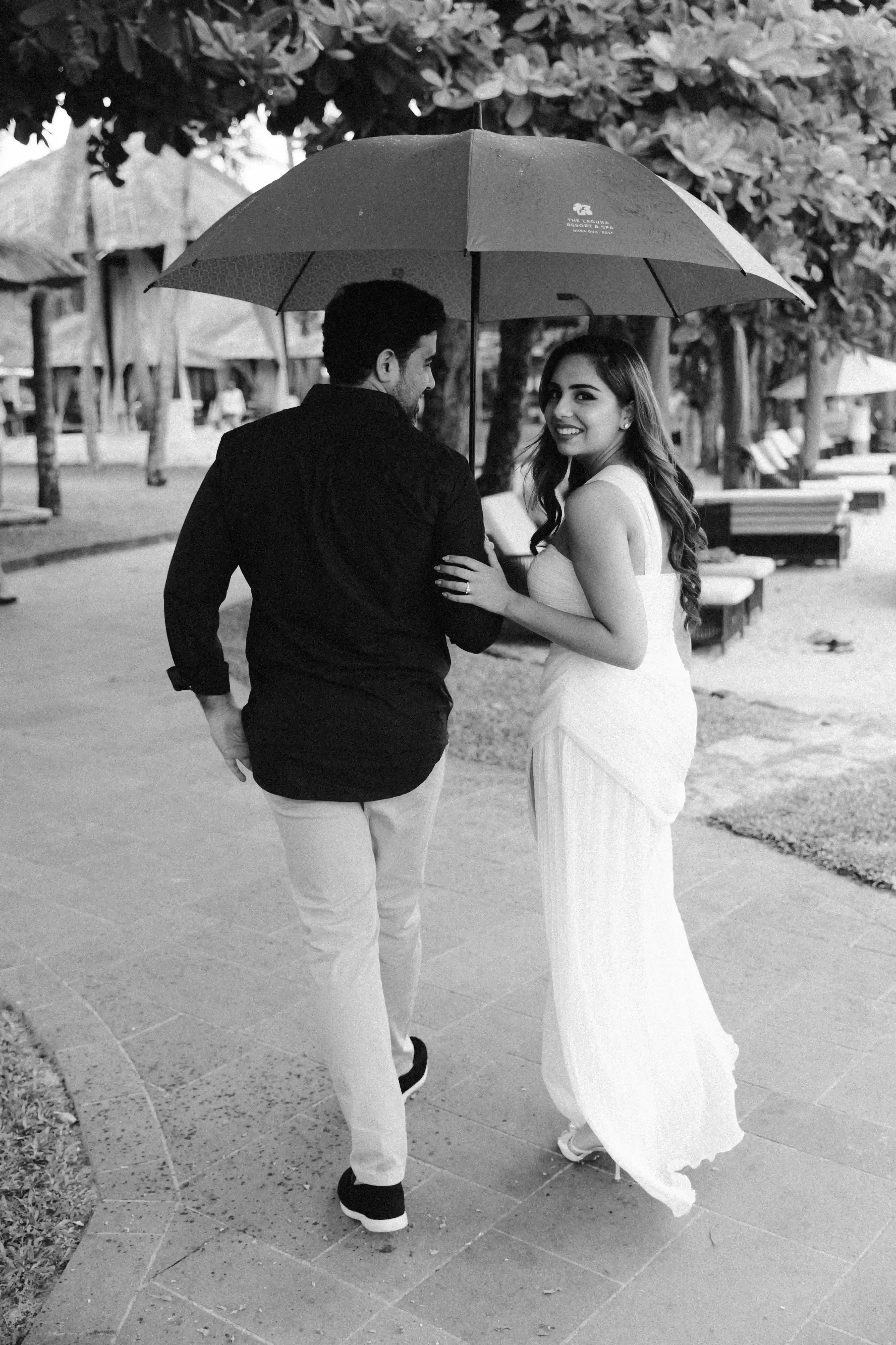 Couple walking together after their luxury beach proposal in Bali