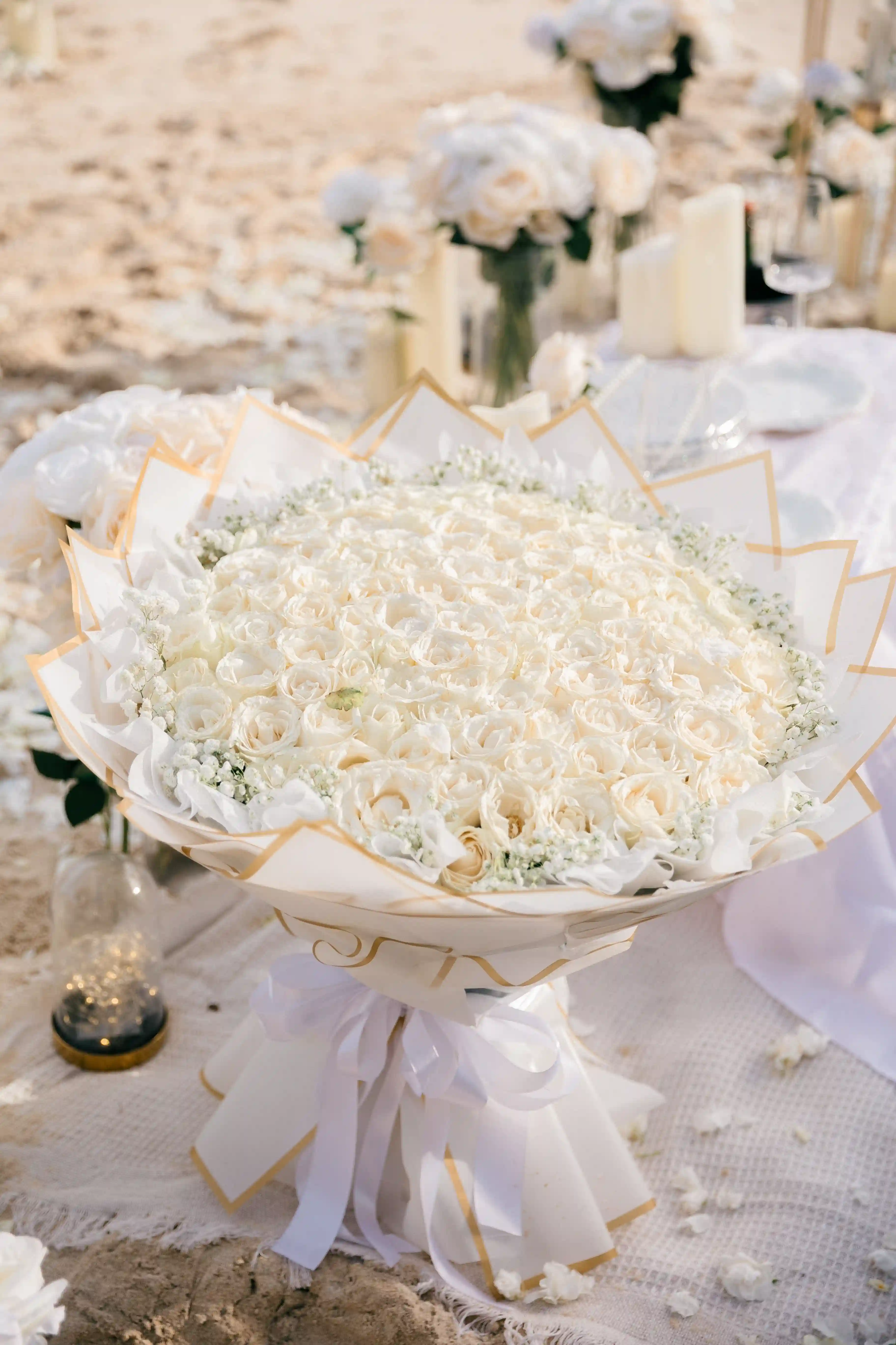 Close-up detail of the white rose bouquet arranged for the proposal.