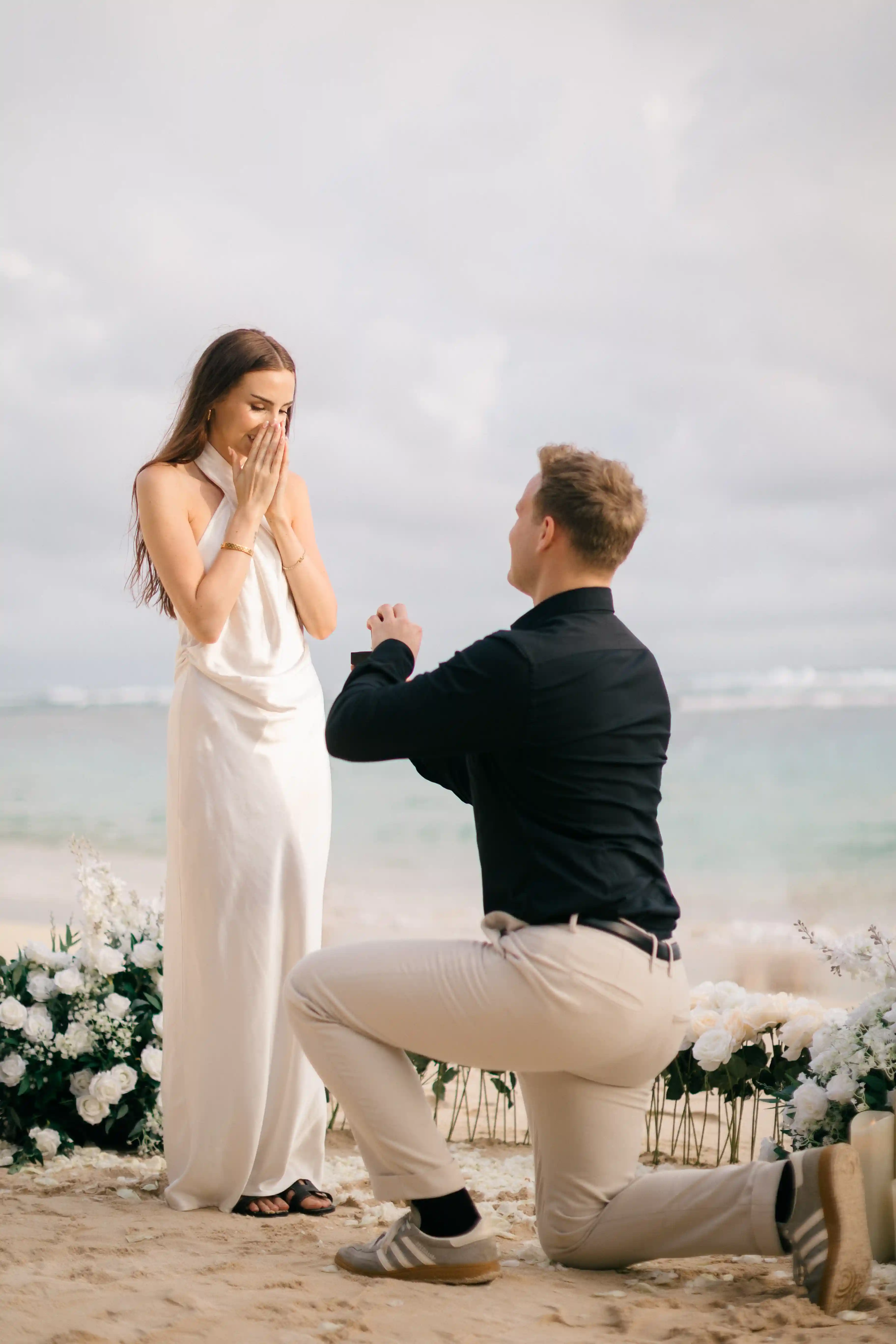 Close-up of the emotional proposal moment as Jasmin reacts with surprise.