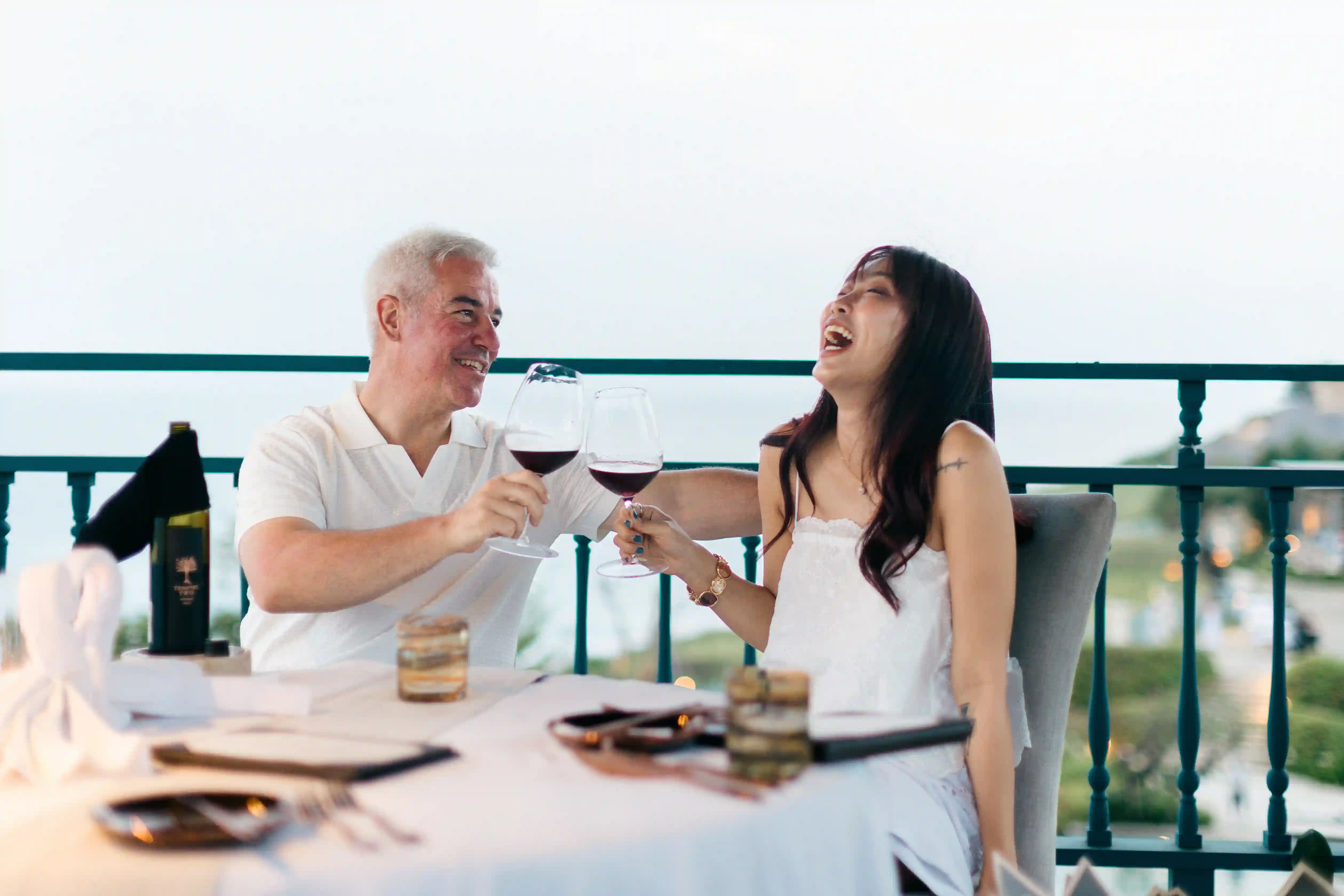 Couple enjoying romantic dinner with ocean view gazebo