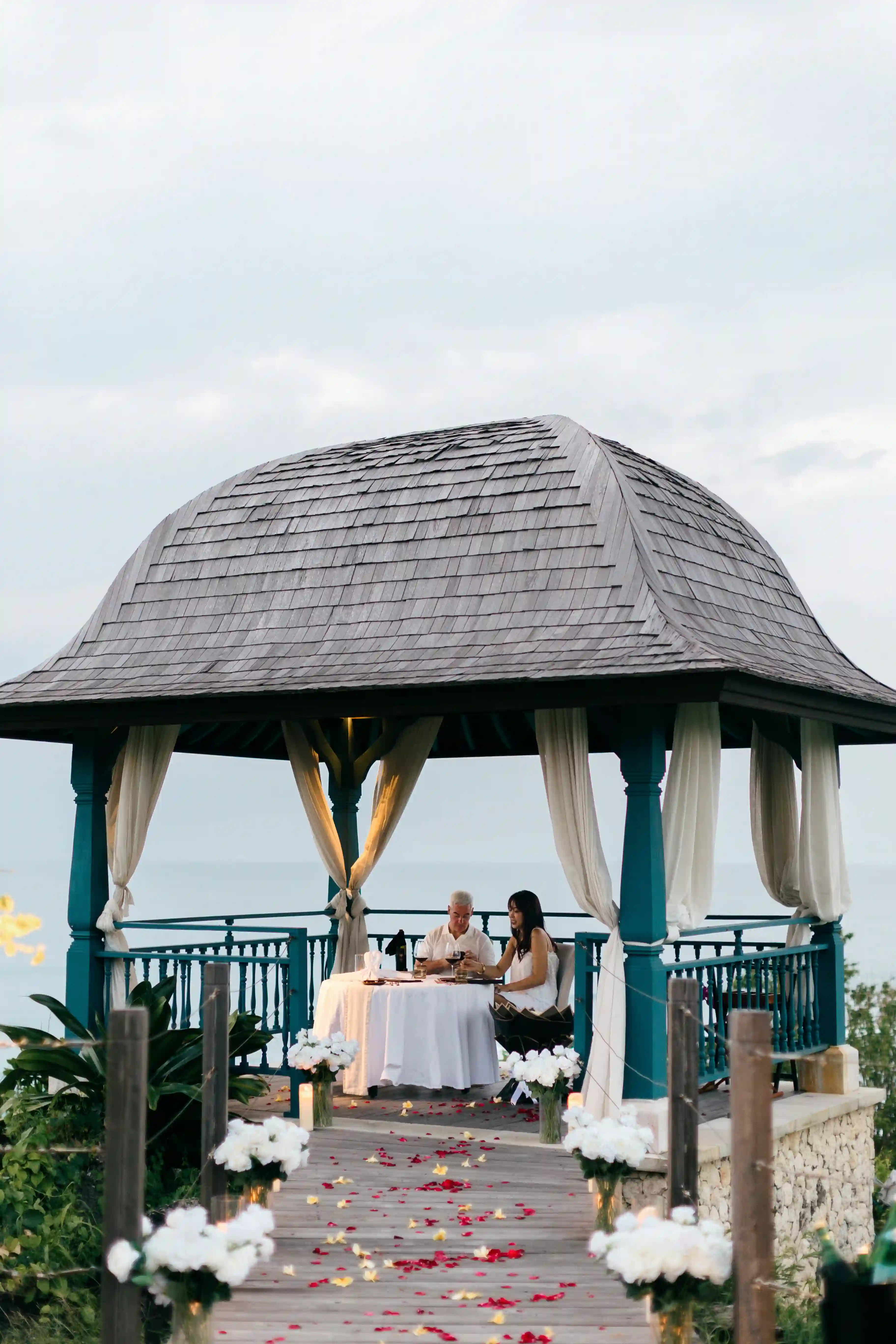 Entrance to romantic proposal dinner setup in gazebo in Bali