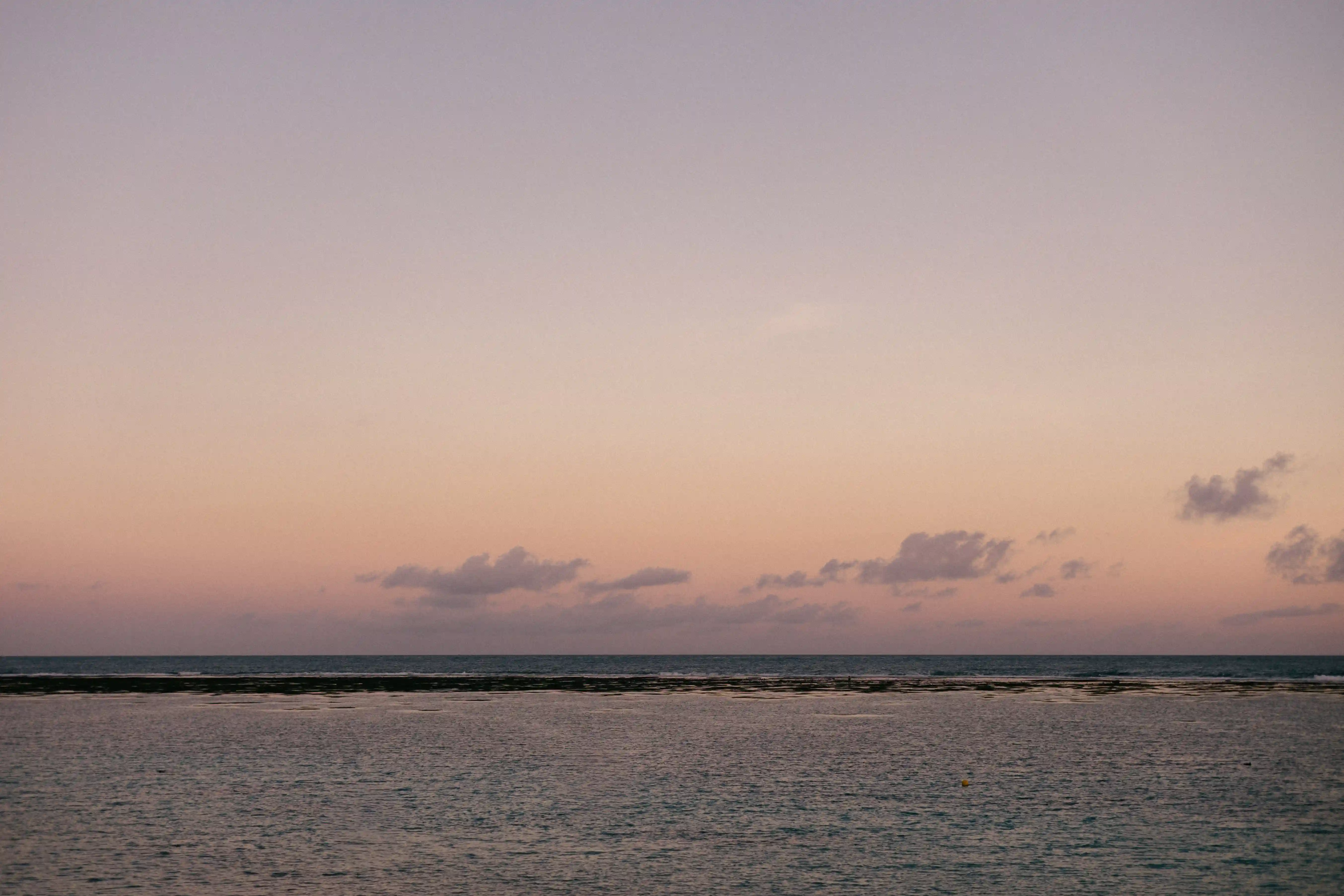 Sunset beach view during romantic proposal setup in Bali