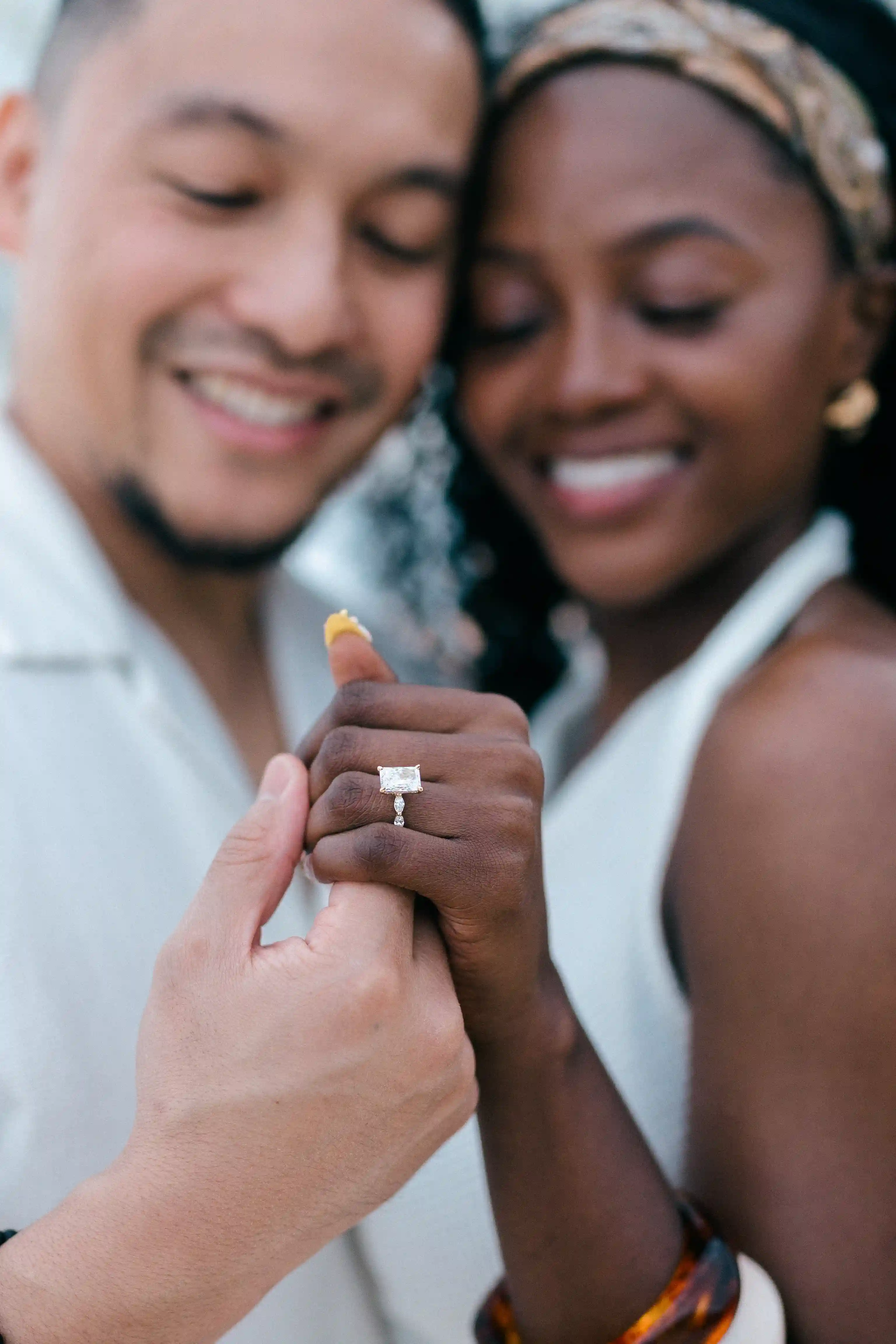Close-up of couple showing engagement ring after Bali proposal