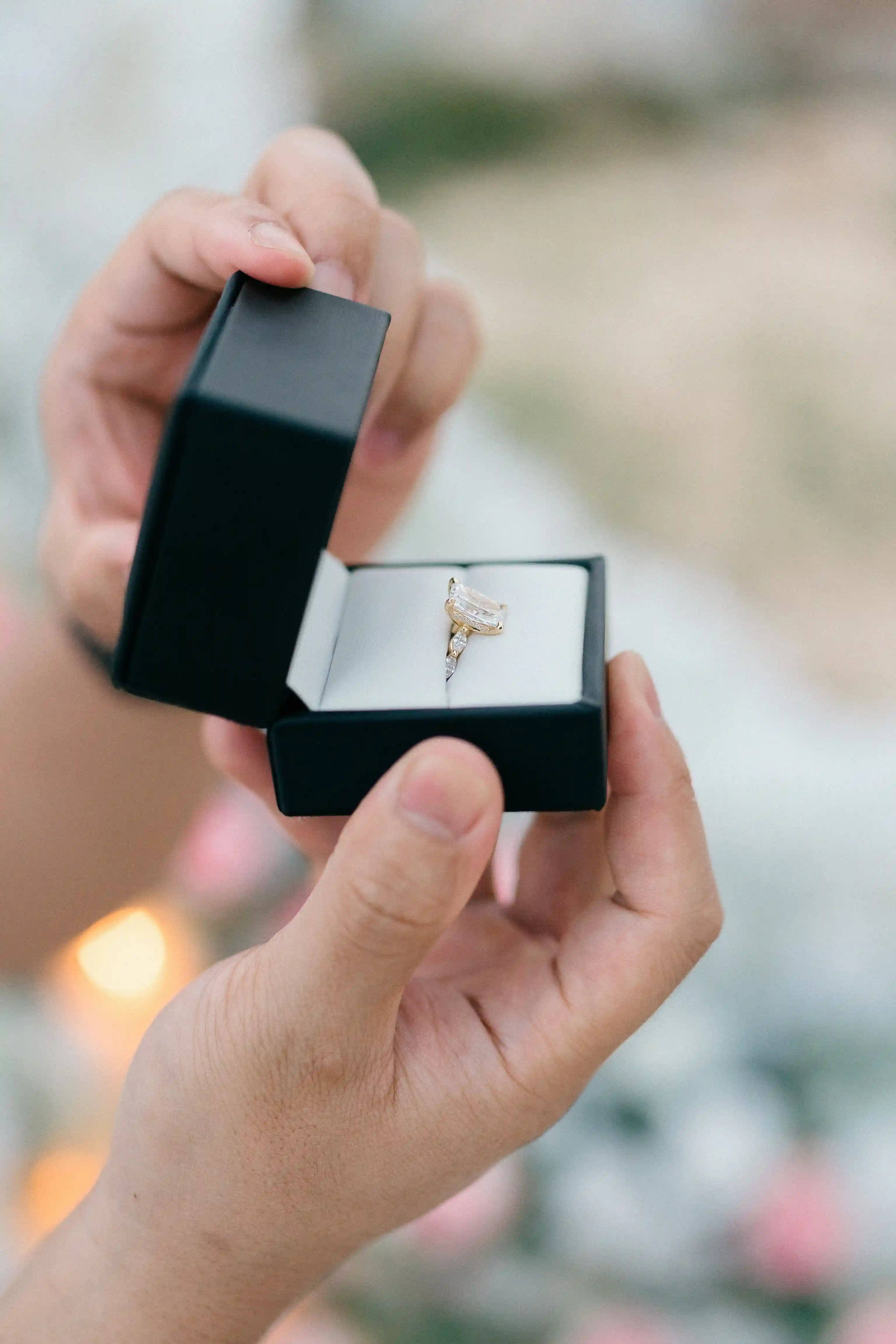 Close-up of engagement ring box during romantic Bali proposal