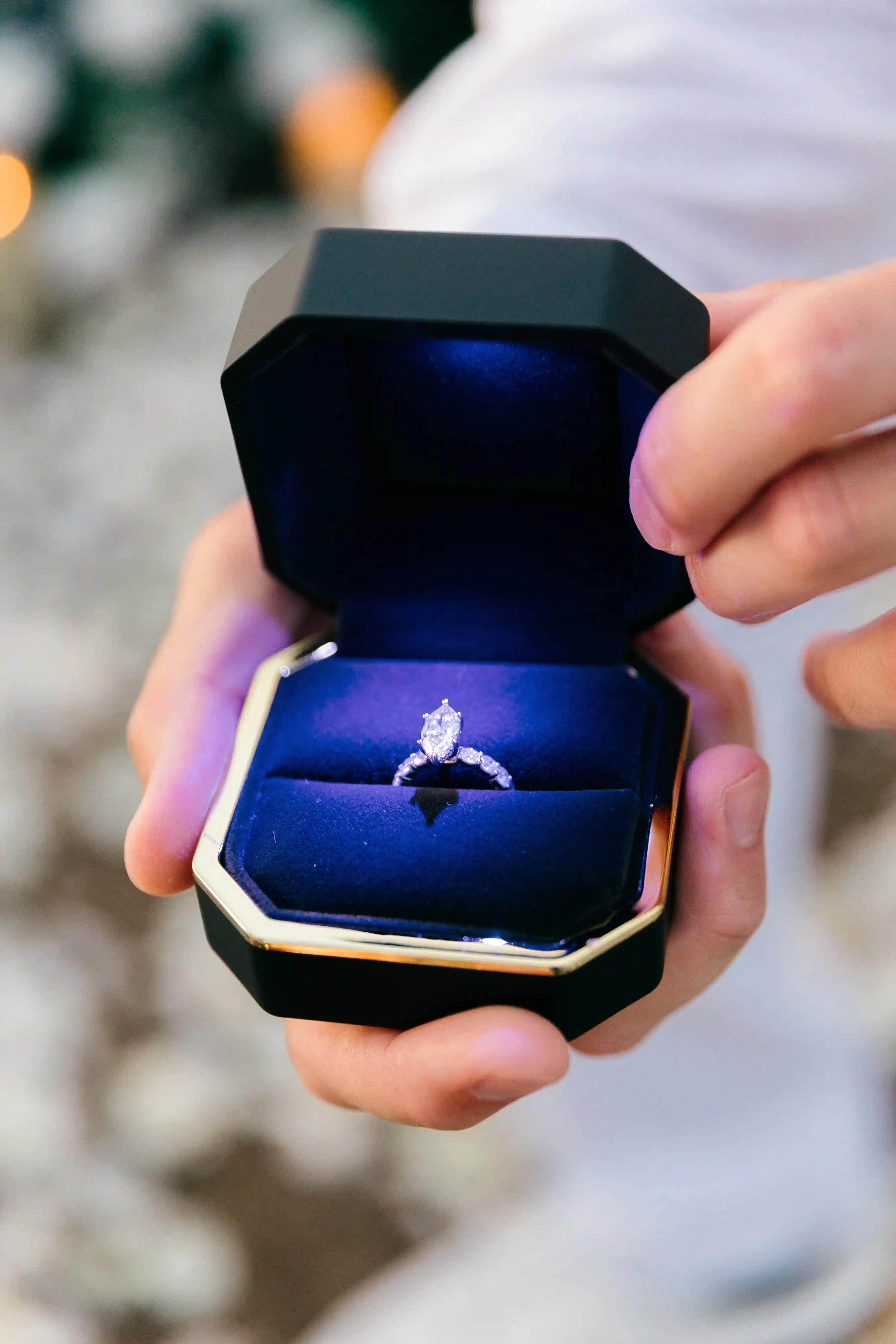 Blue velvet engagement ring box held during Bali proposal