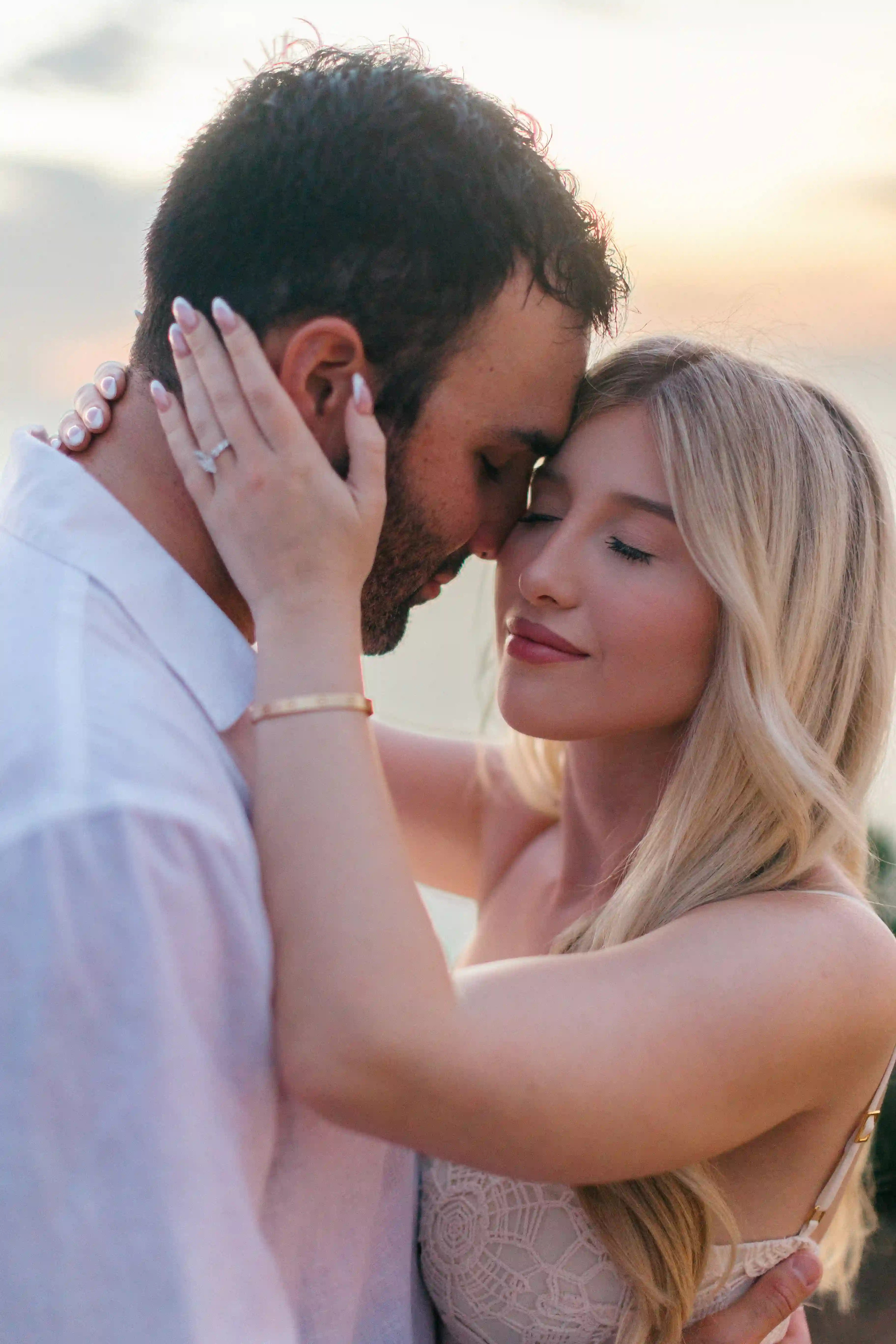 Romantic close-up portrait of engaged couple during sunset proposal in Bali