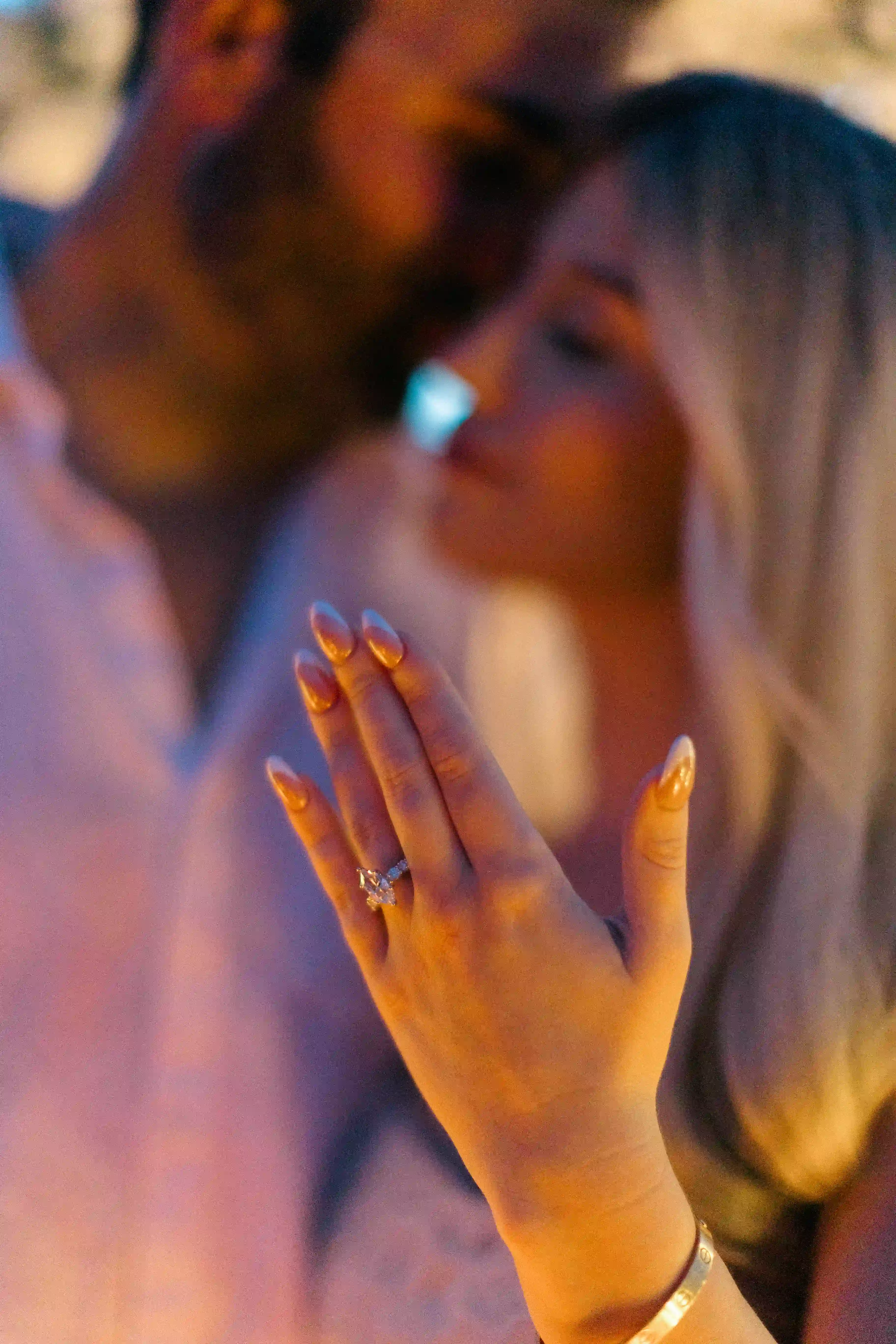 Romantic close-up of couple during candlelit proposal celebration