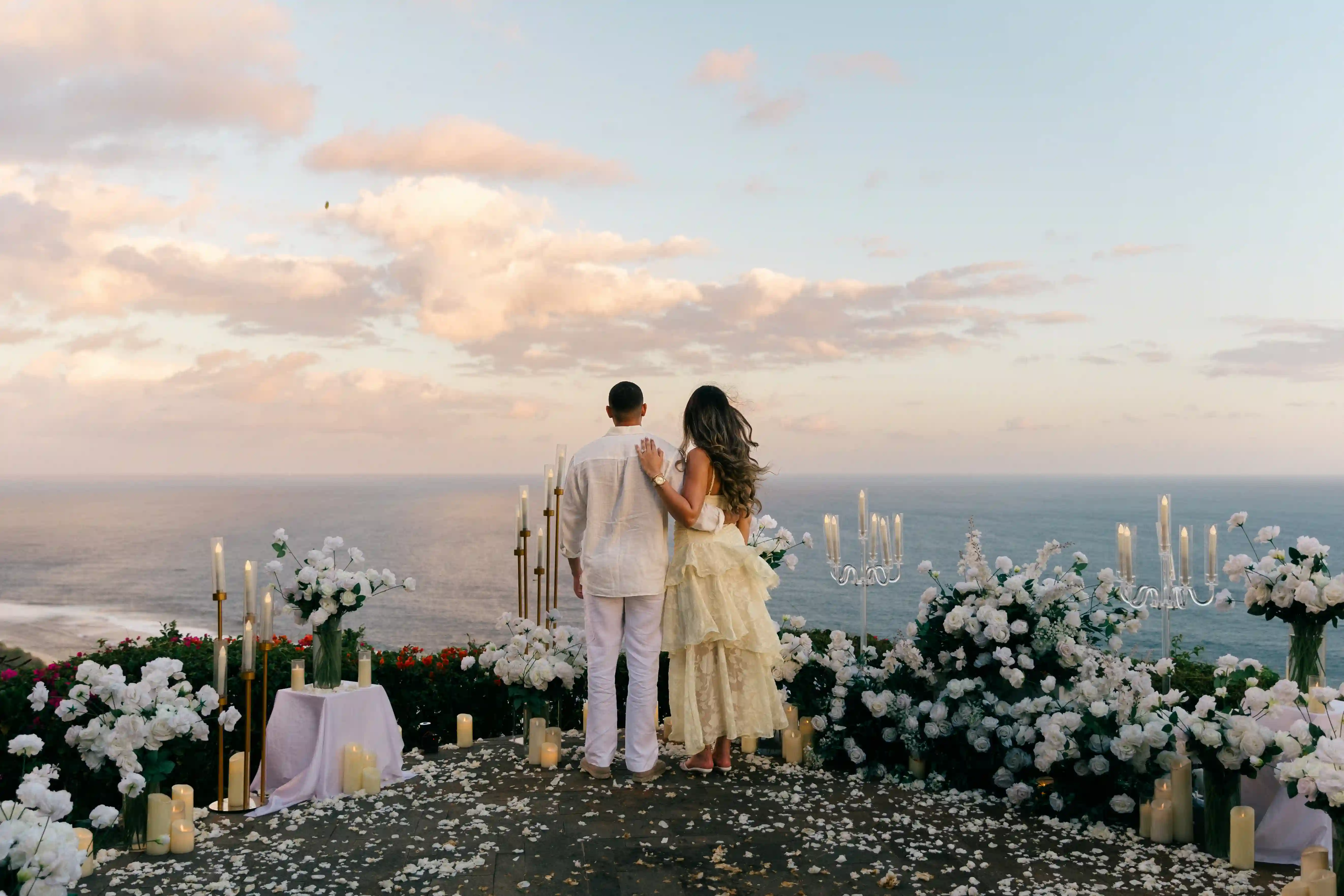 Newly engaged couple on a Bali clifftop at sunset